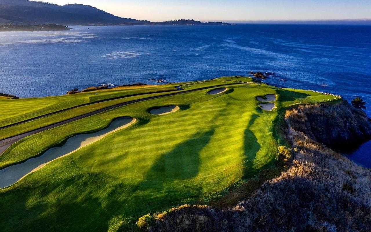 Overhead view of a well maintained fairway with coastal views