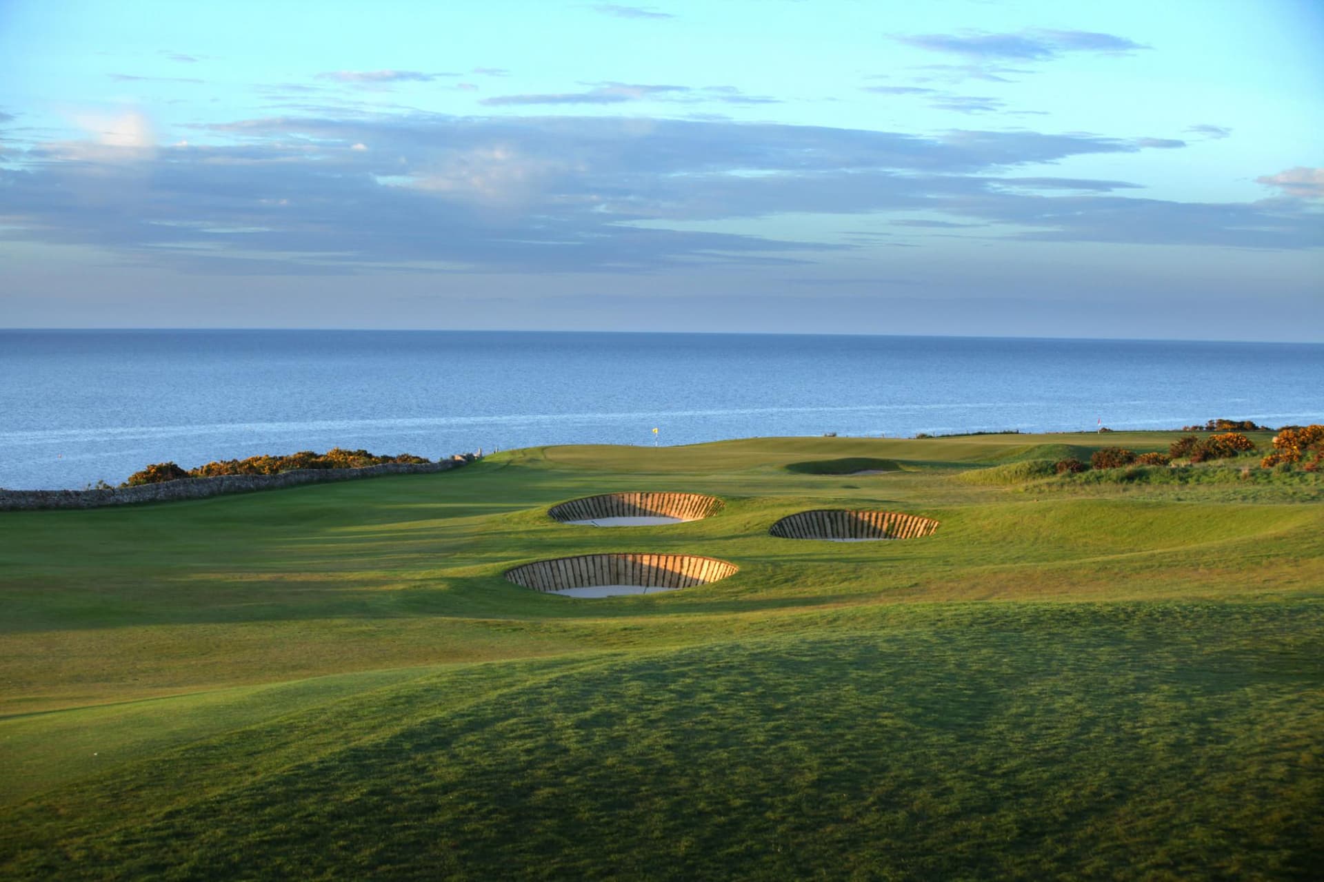 A well maintained coastal fairway with deep sand bunkers