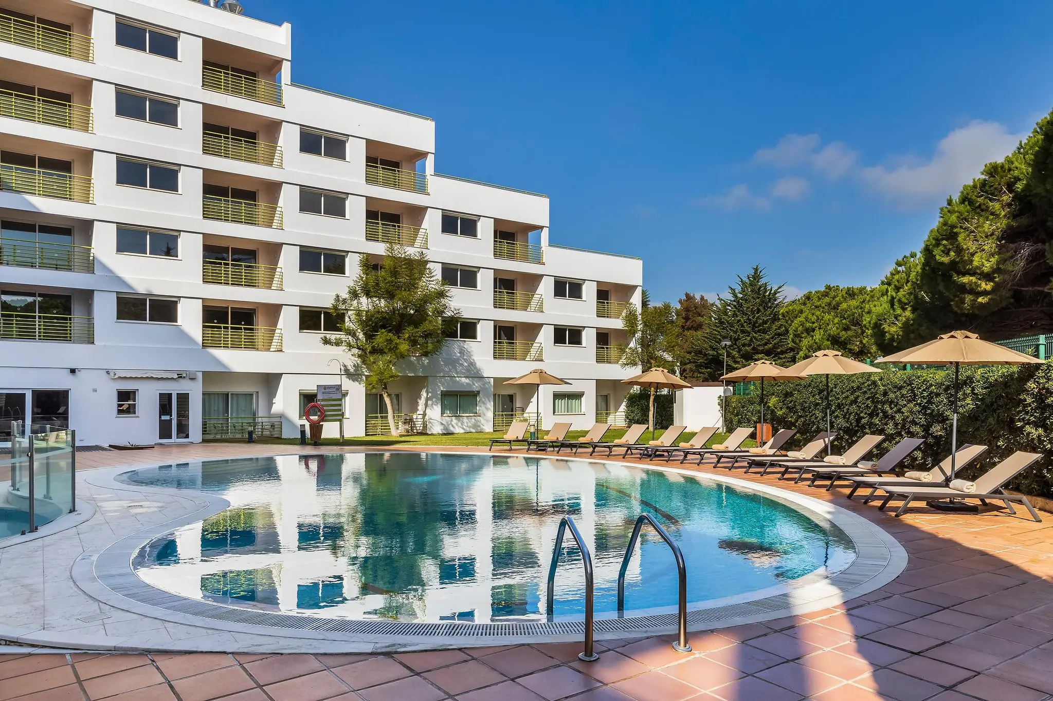 Outdoor swimming pool at The Patio Suite Hotel