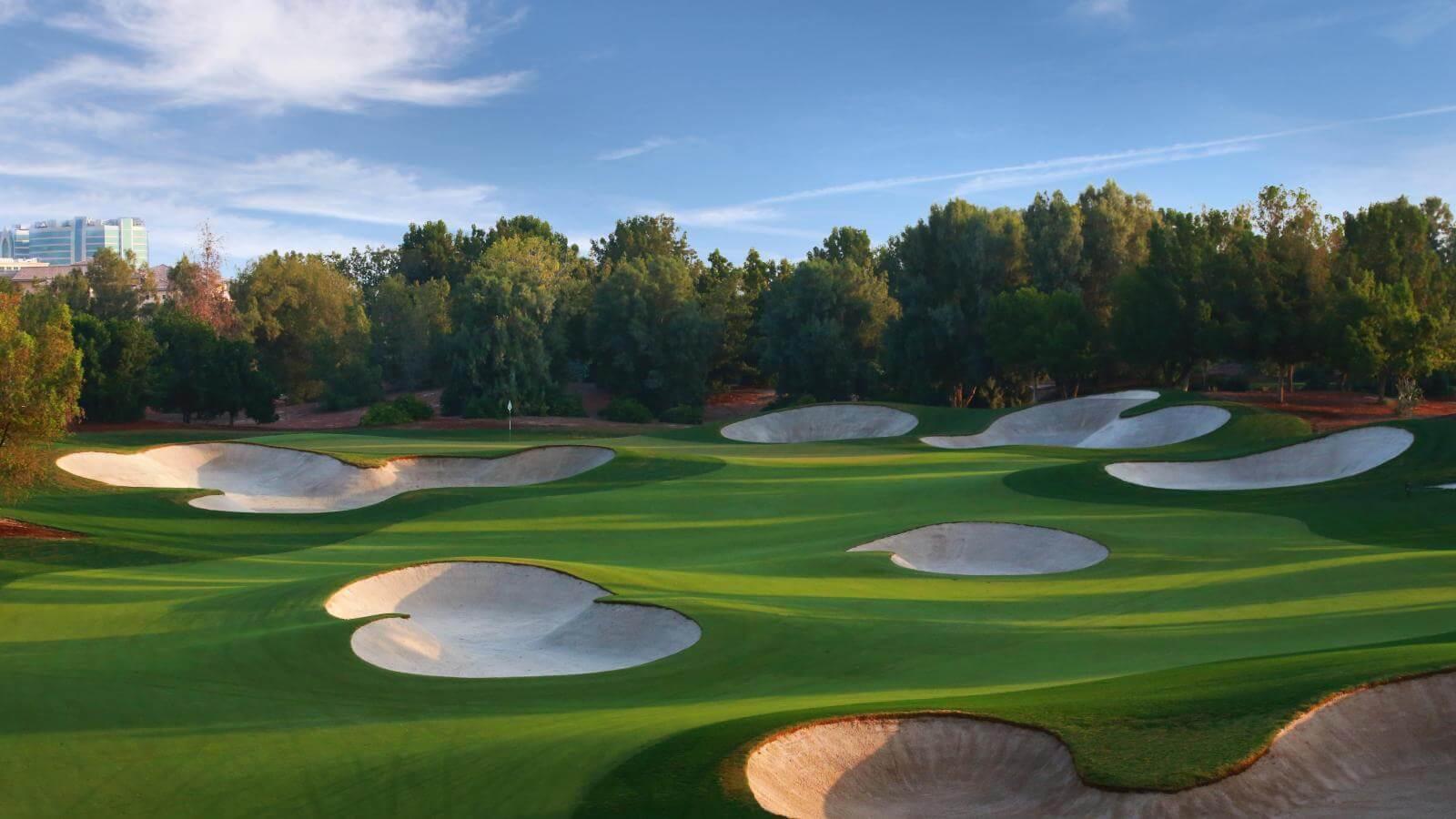 A smooth green surrounded by sand bunkers