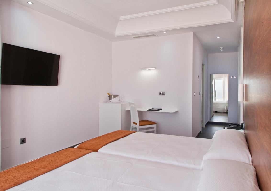 Double bed suite with balcony views at Delfines Hotel & Suites