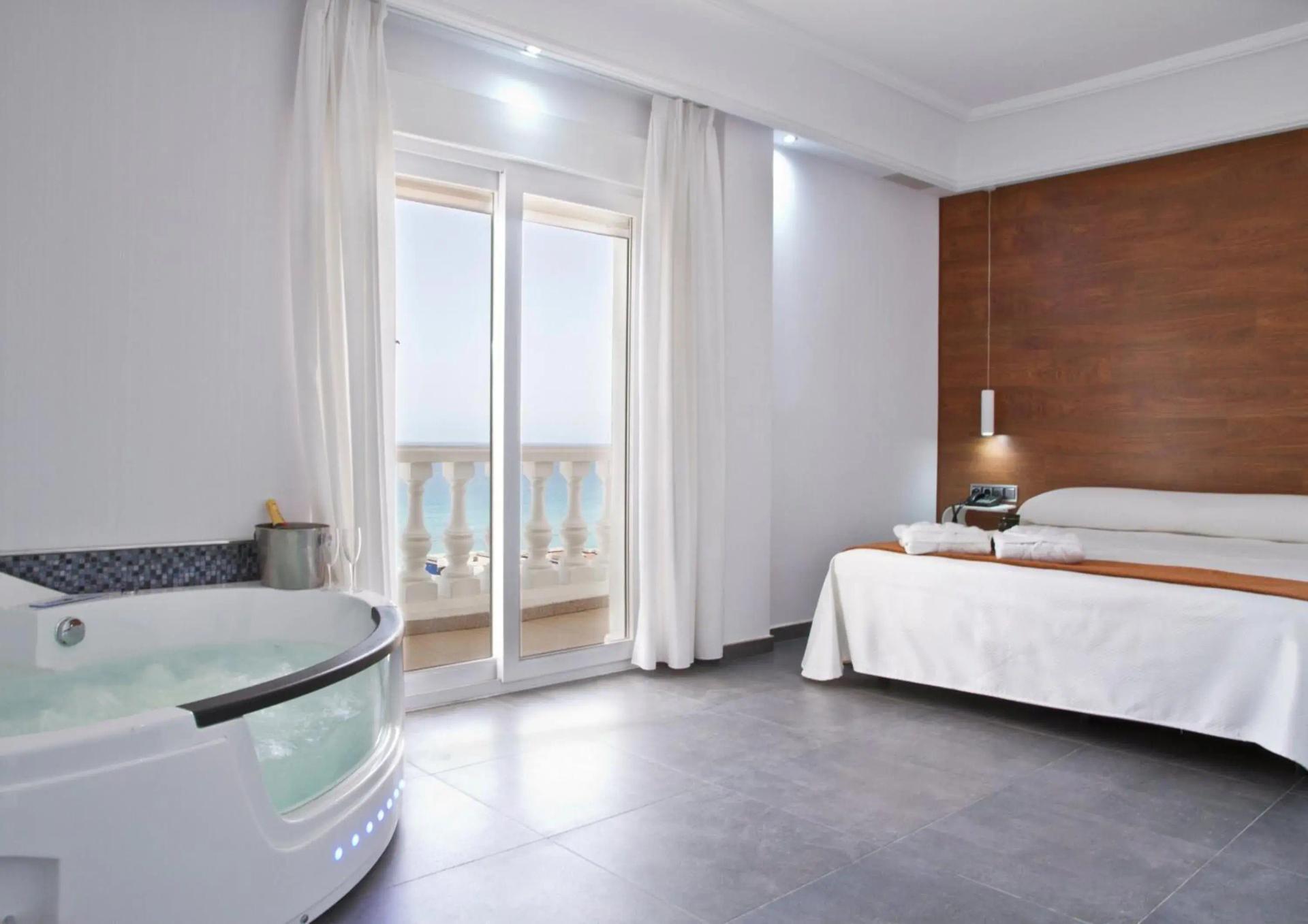 Double bed suite with jacuzzi bath and balcony views