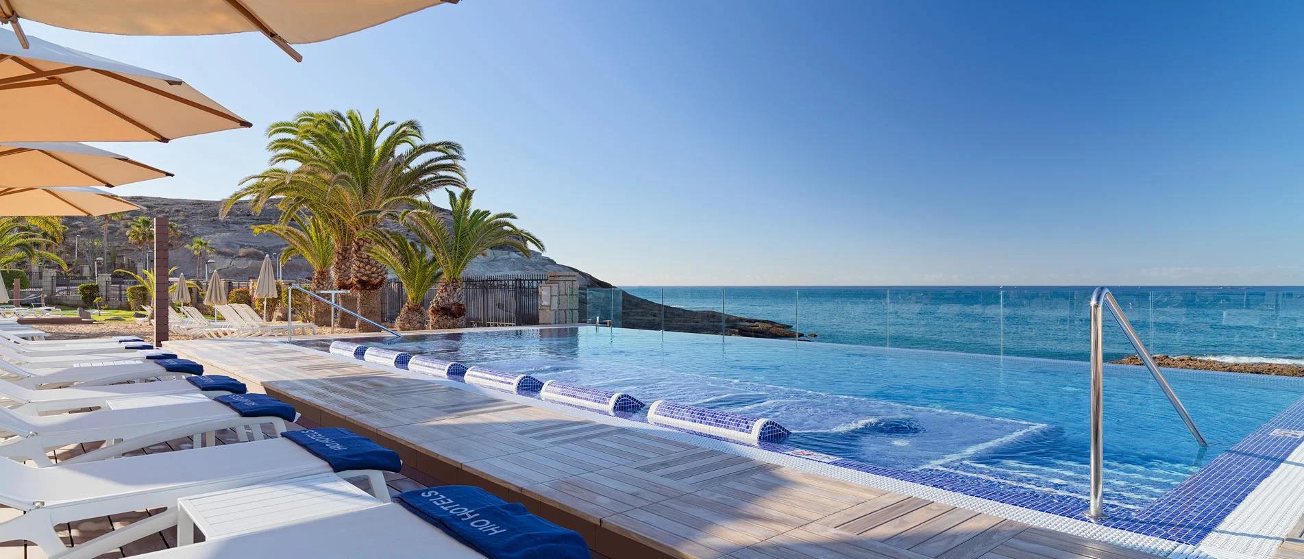Outdoor infinity pool at H10 Costa Adeje Palace with ocean views