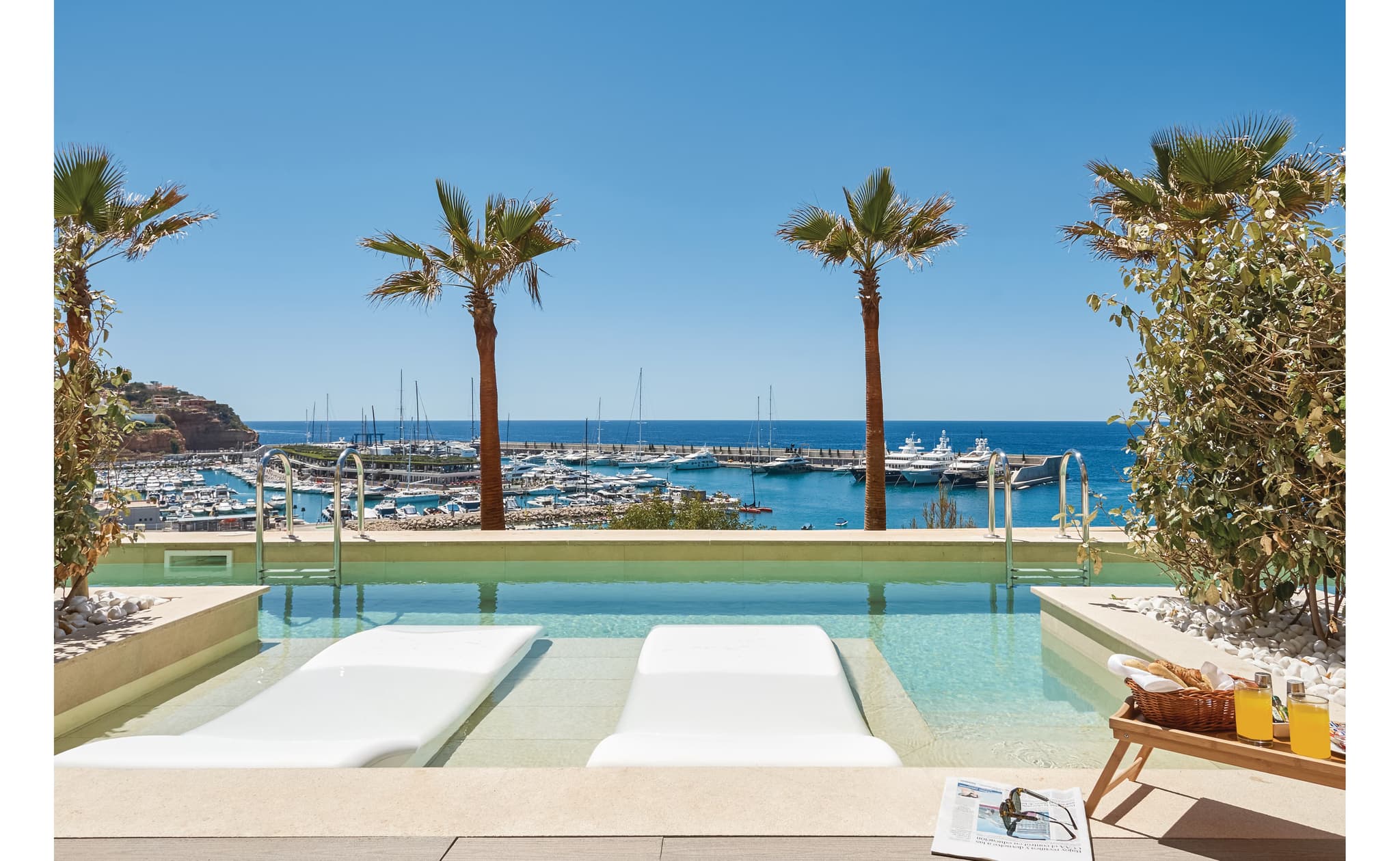 Outdoor swimming pool at Pure Salt Port Adriano with ocean views