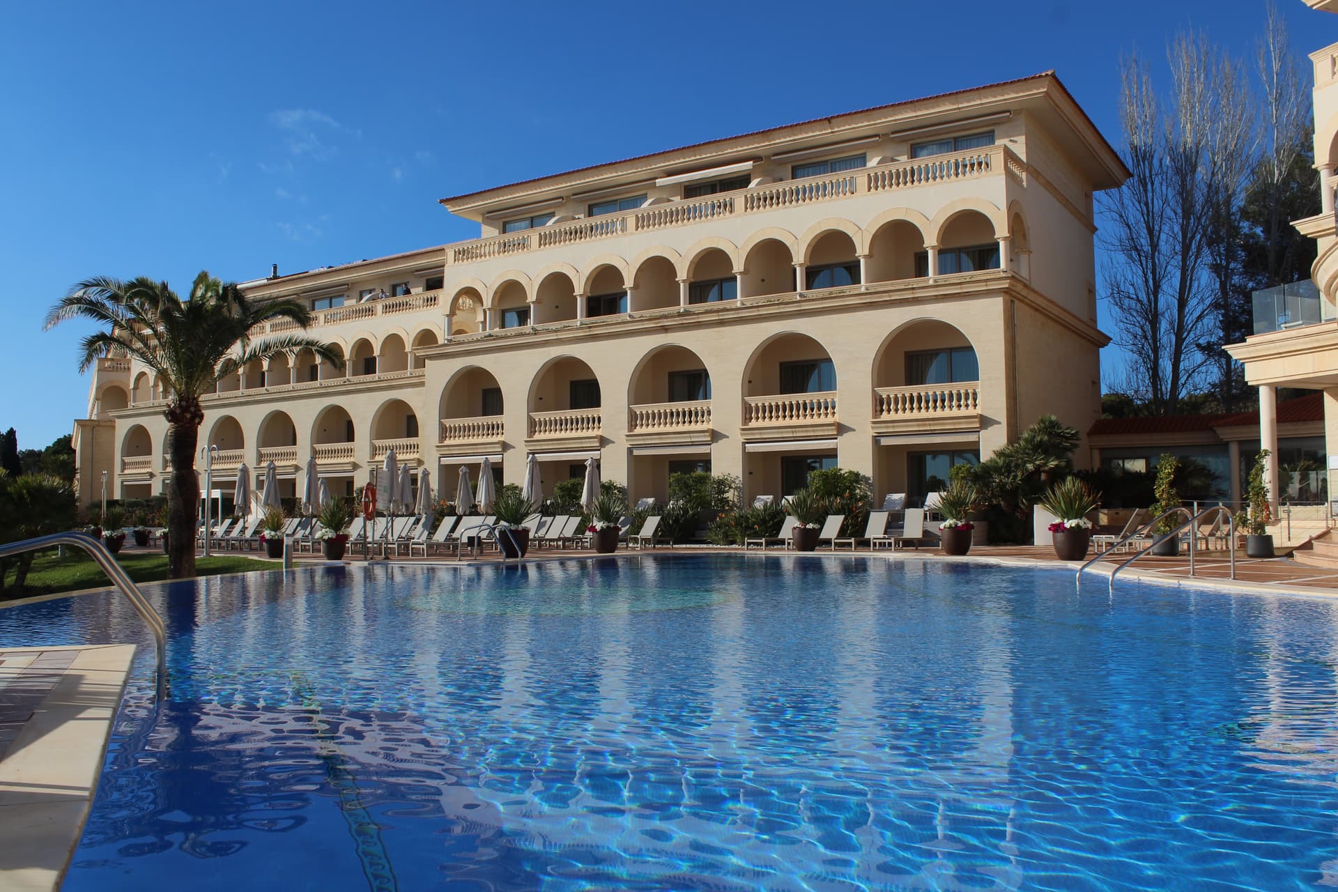 The Pure Salt Port Adriano building overlooking the outdoor pool