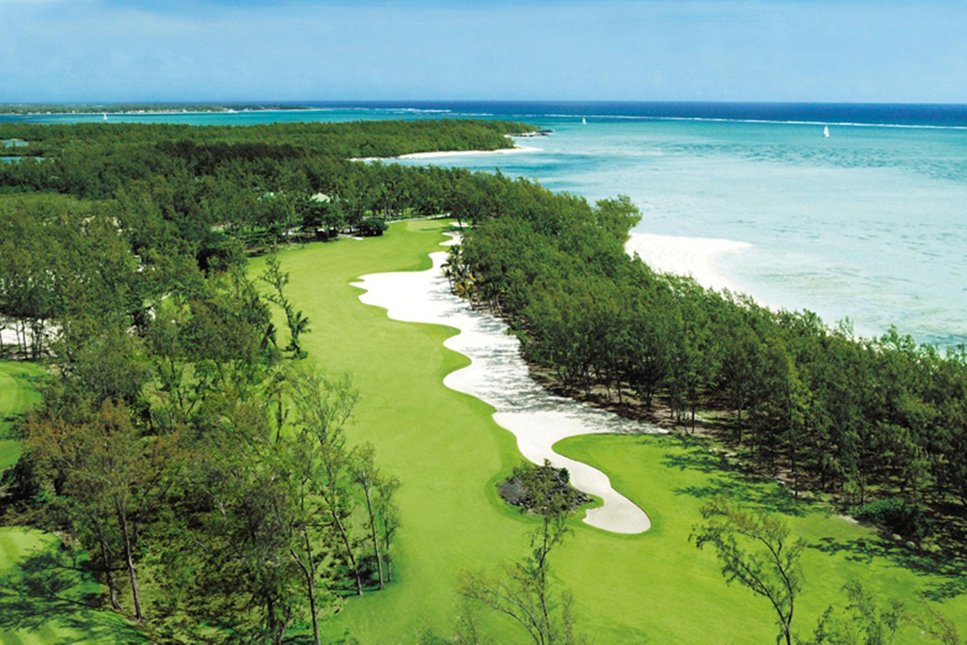 A well maintained fairway with a large sand bunker
