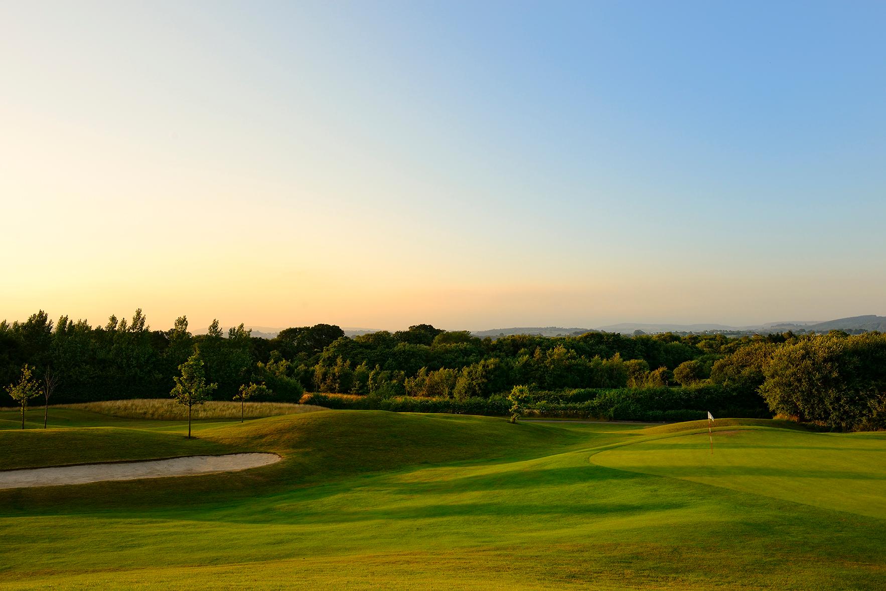 A well maintained fairway with a sand bunker