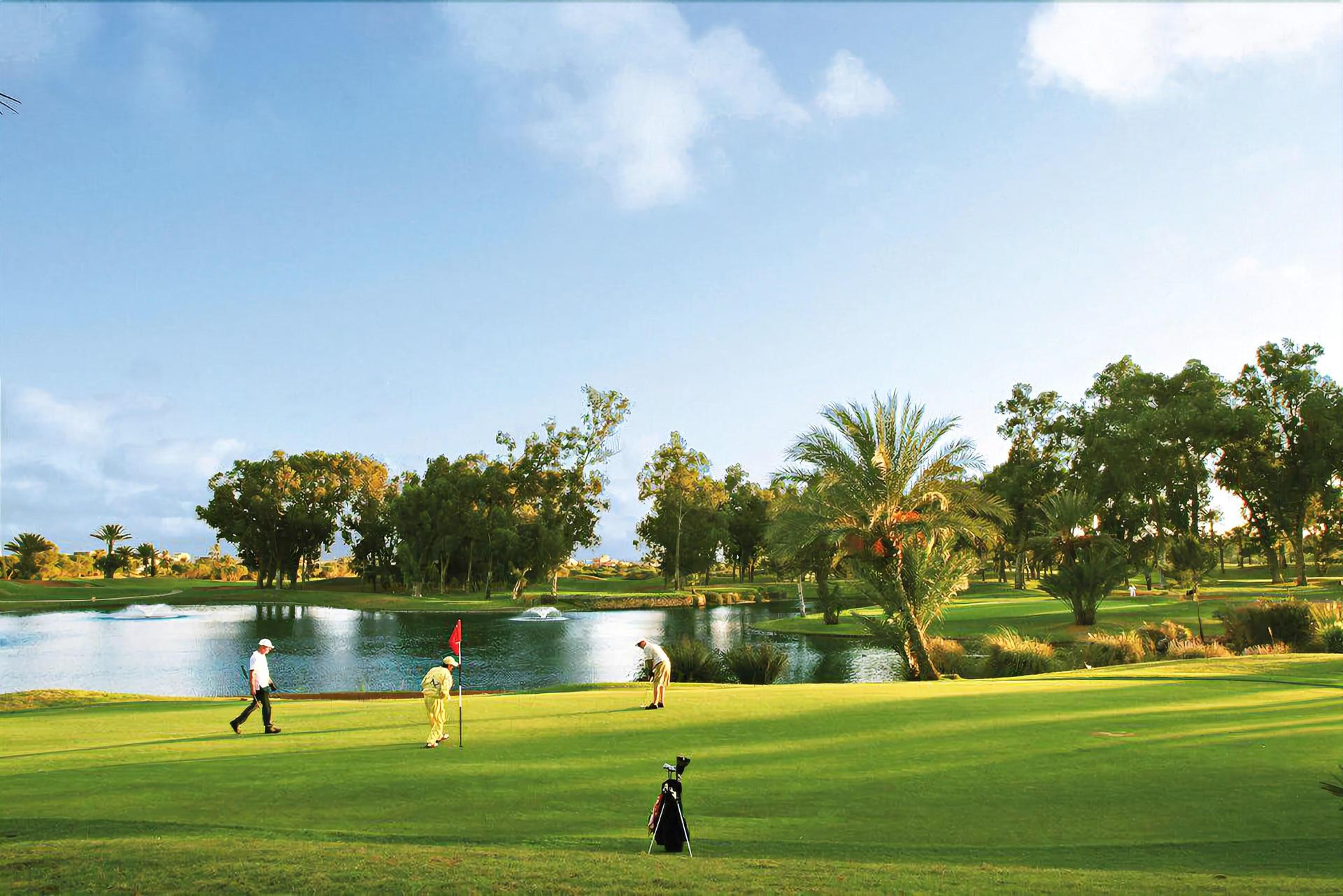 A well maintained fairway with golfers