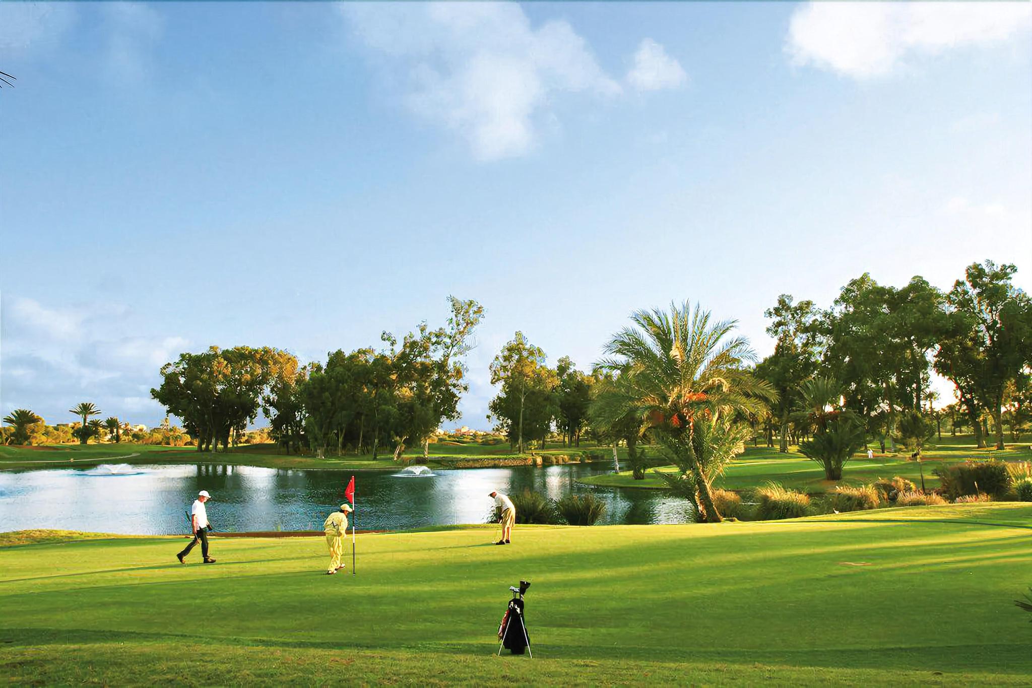 A well maintained fairway with golfers