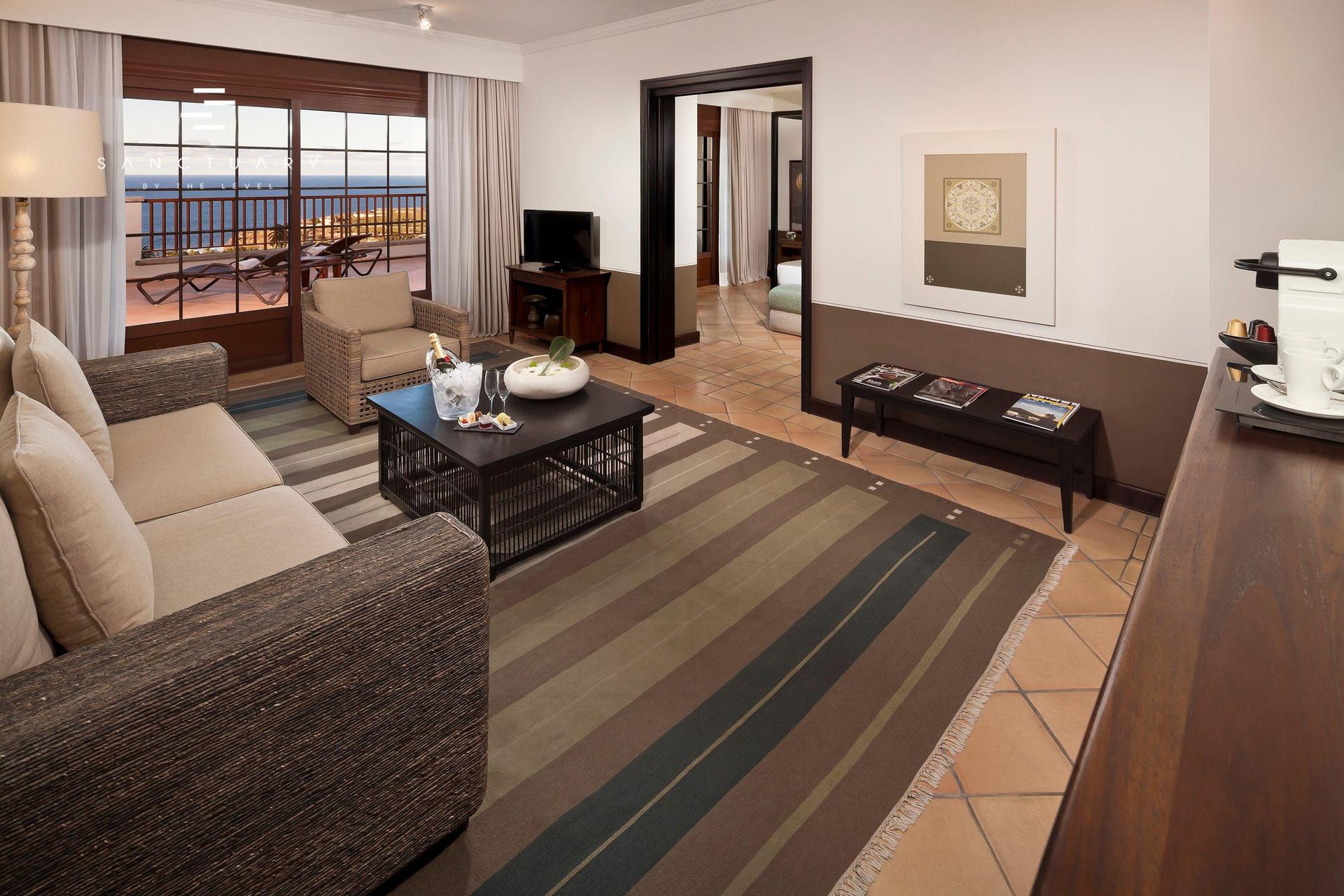 Living room as part of a double bed suite at Melia Hacienda Del Conde