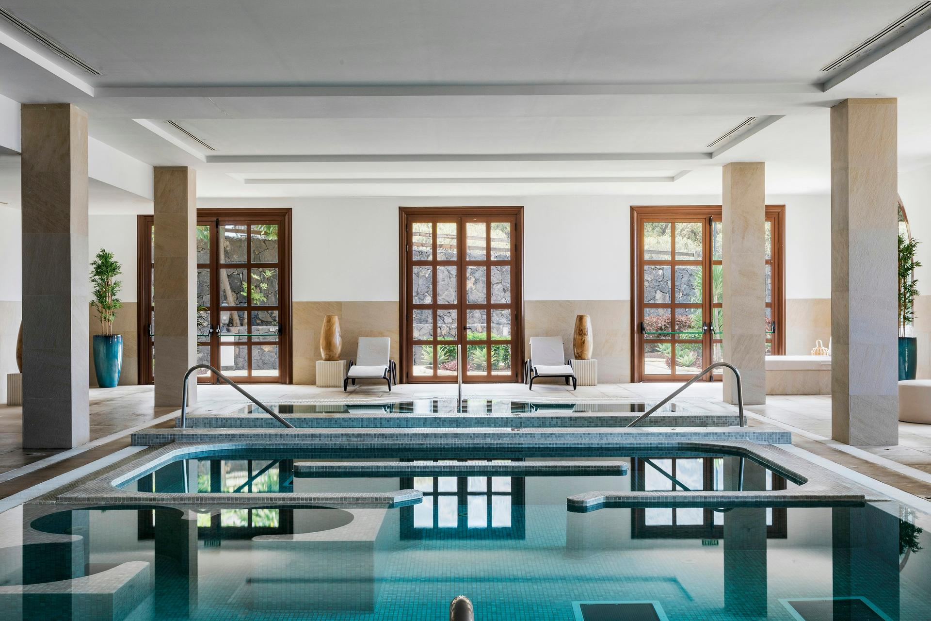 Indoor pool as part of the spa facilities at Melia Hacienda Del Conde