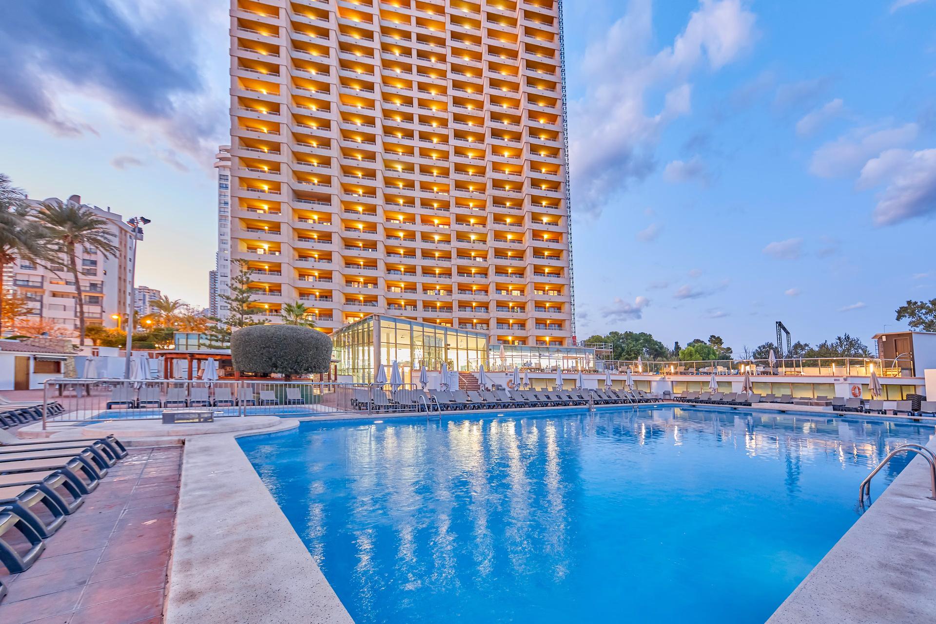 Panoramic view of the Sandos Benidorm Suites building overlooking the outdoor pool