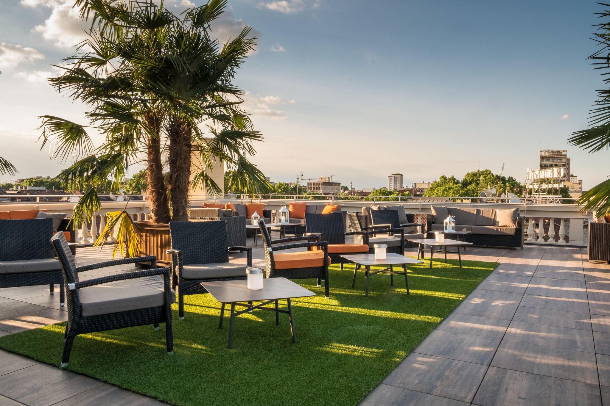 Rooftop lounging area at Turin Palace Hotel
