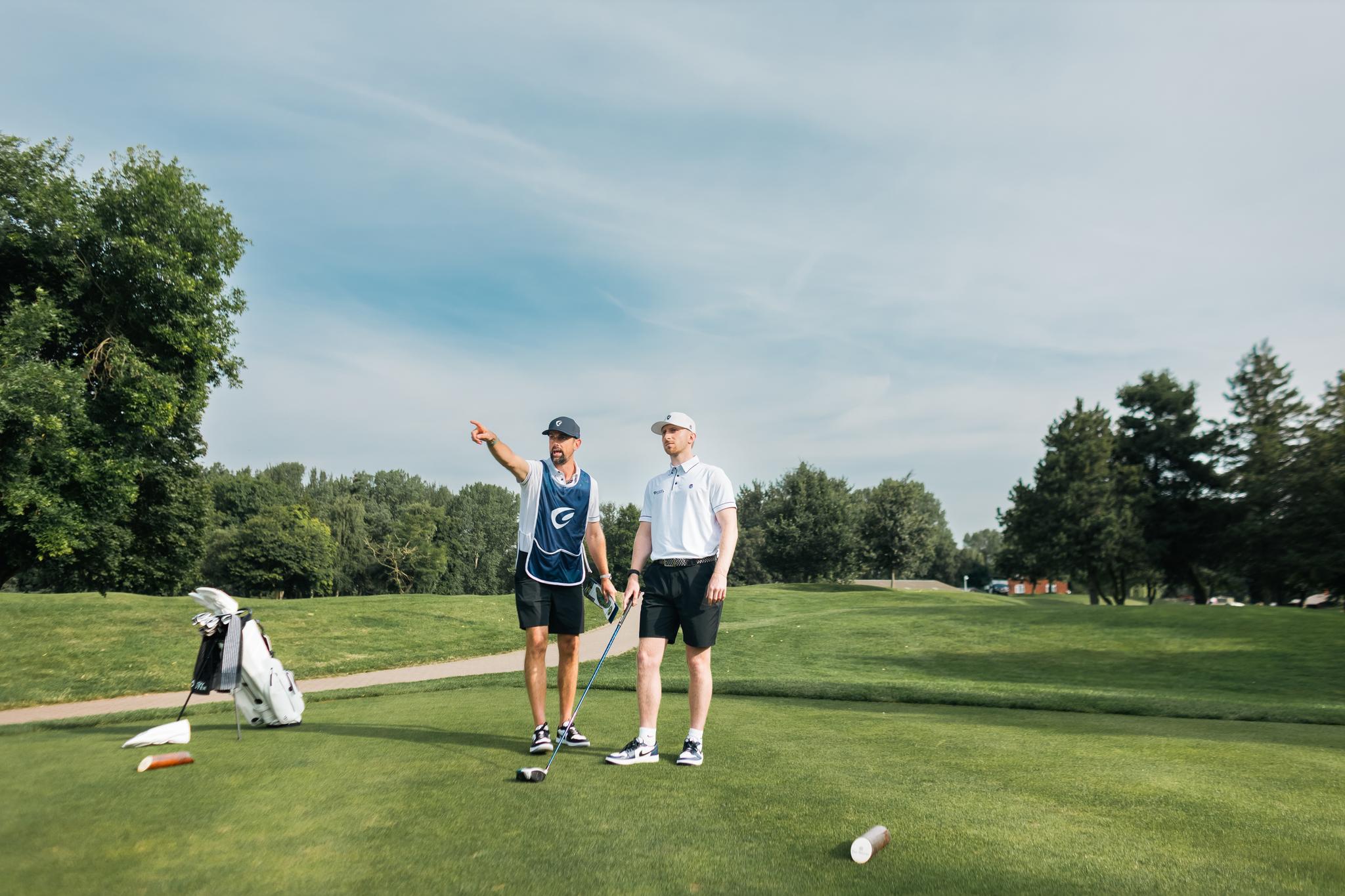 A Caddy showing a golfer where to aim for.