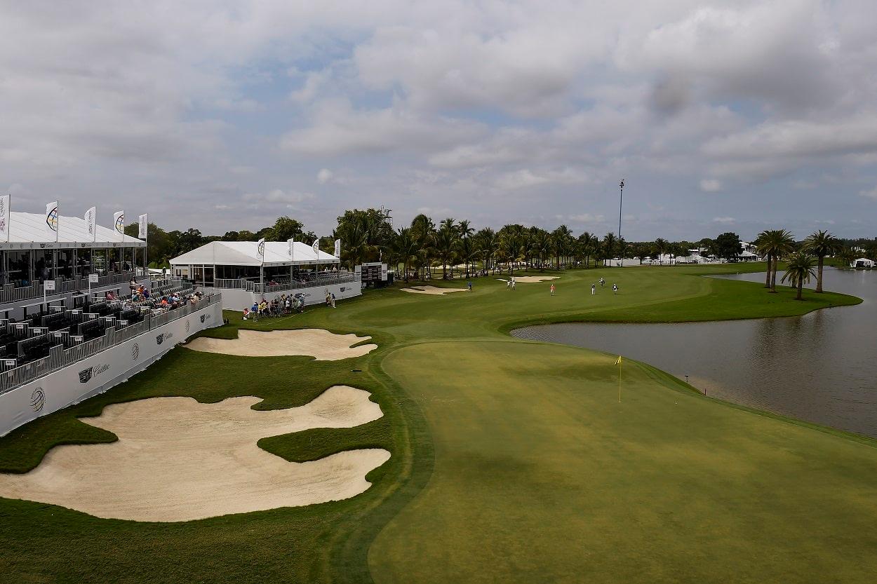 A well maintained fairway nestled with sand bunkers