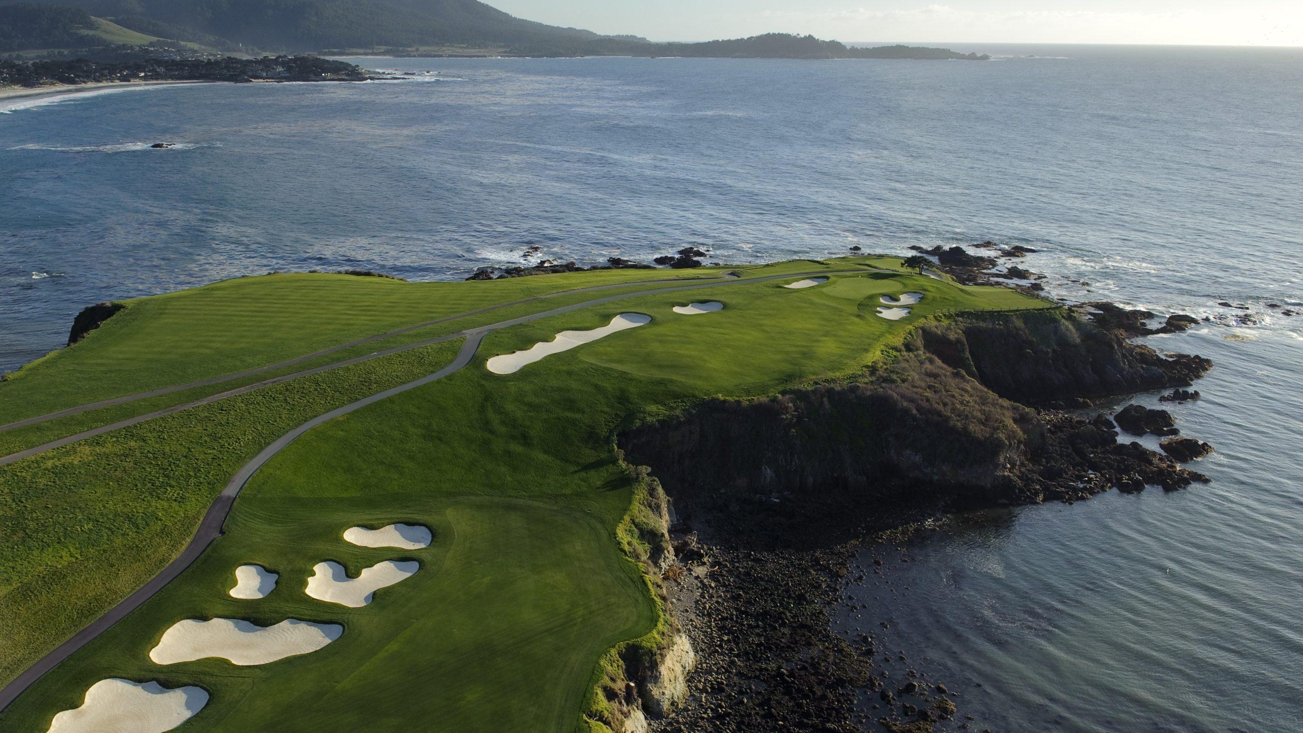 Overhead view of a well maintained fairway nestled with sand bunkers