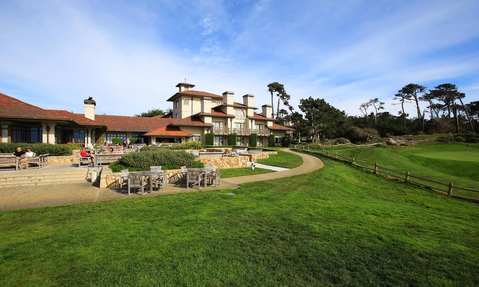Panoramic view of the The Inn at Spanish Bay & Pebble Beach clubhouse overlooking the course