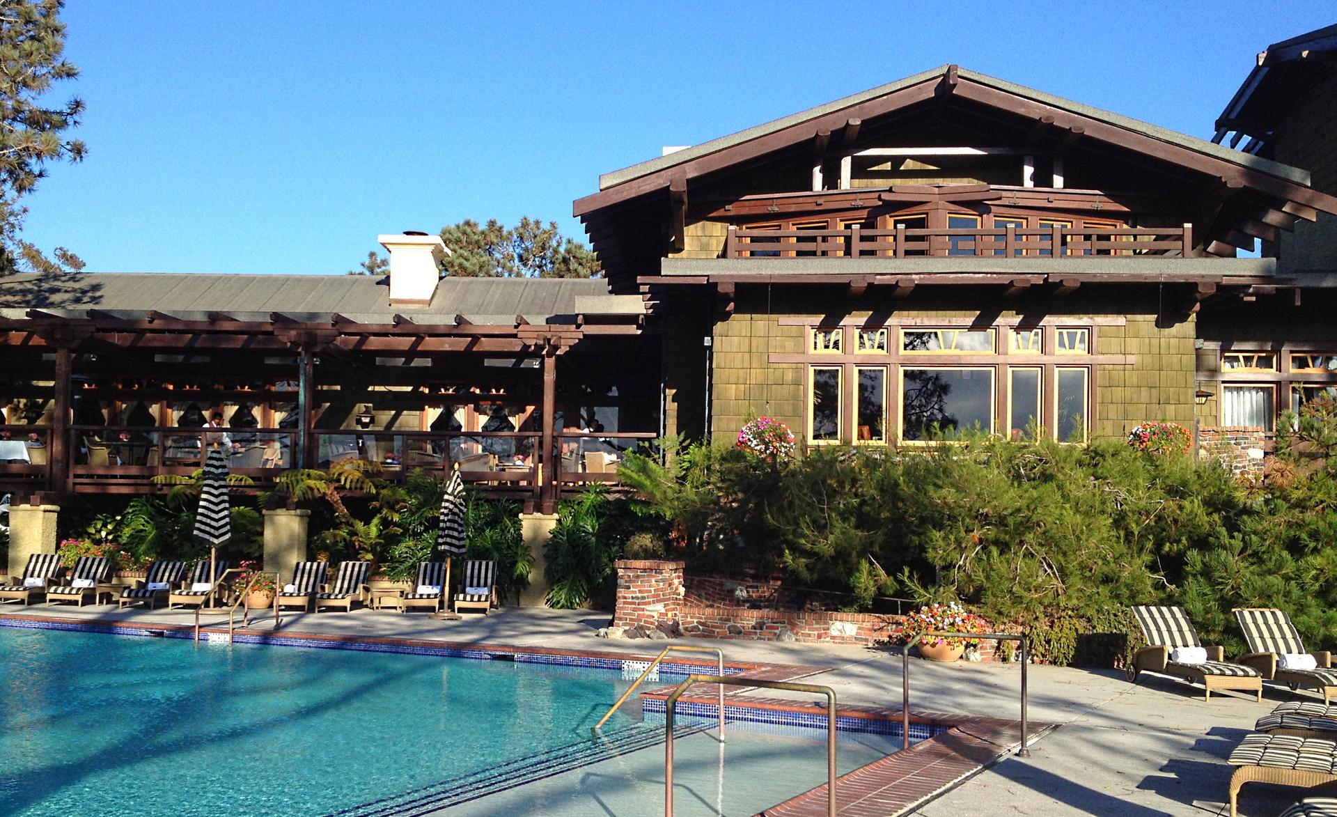 The Lodge at Torrey Pines building with an outdoor swimming pool