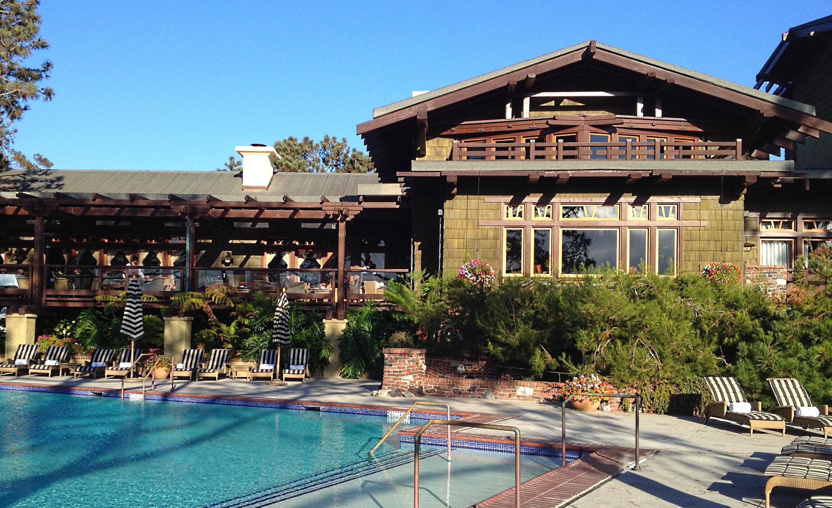 The Lodge at Torrey Pines building with an outdoor swimming pool