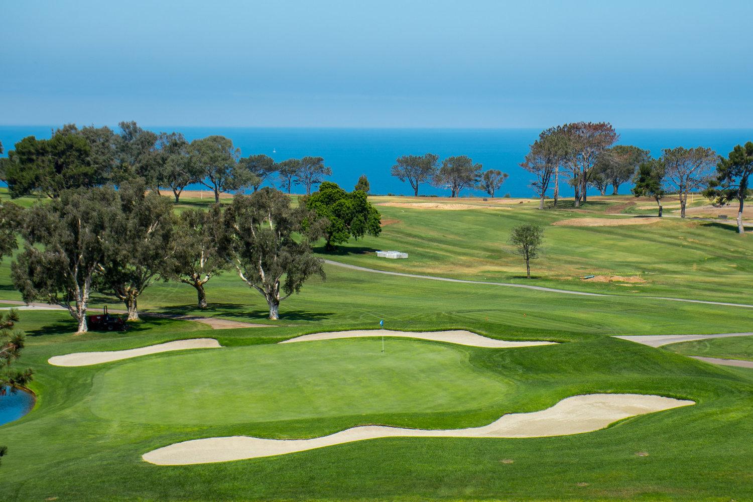 A manicured fairway surrounded by sand bunkers