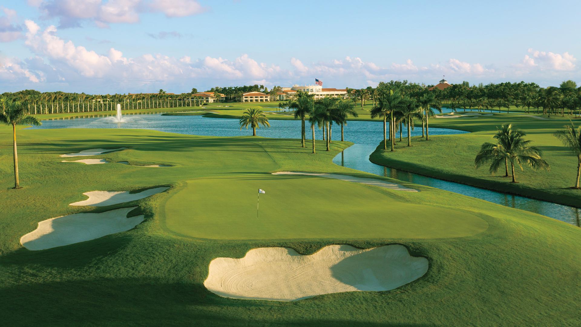 A manicured green surrounded by sand bunkers at the Trump Doral