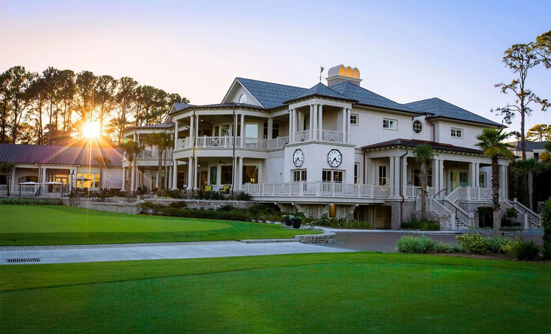 The Sea Pines Resort with the sun shining through the trees in the background