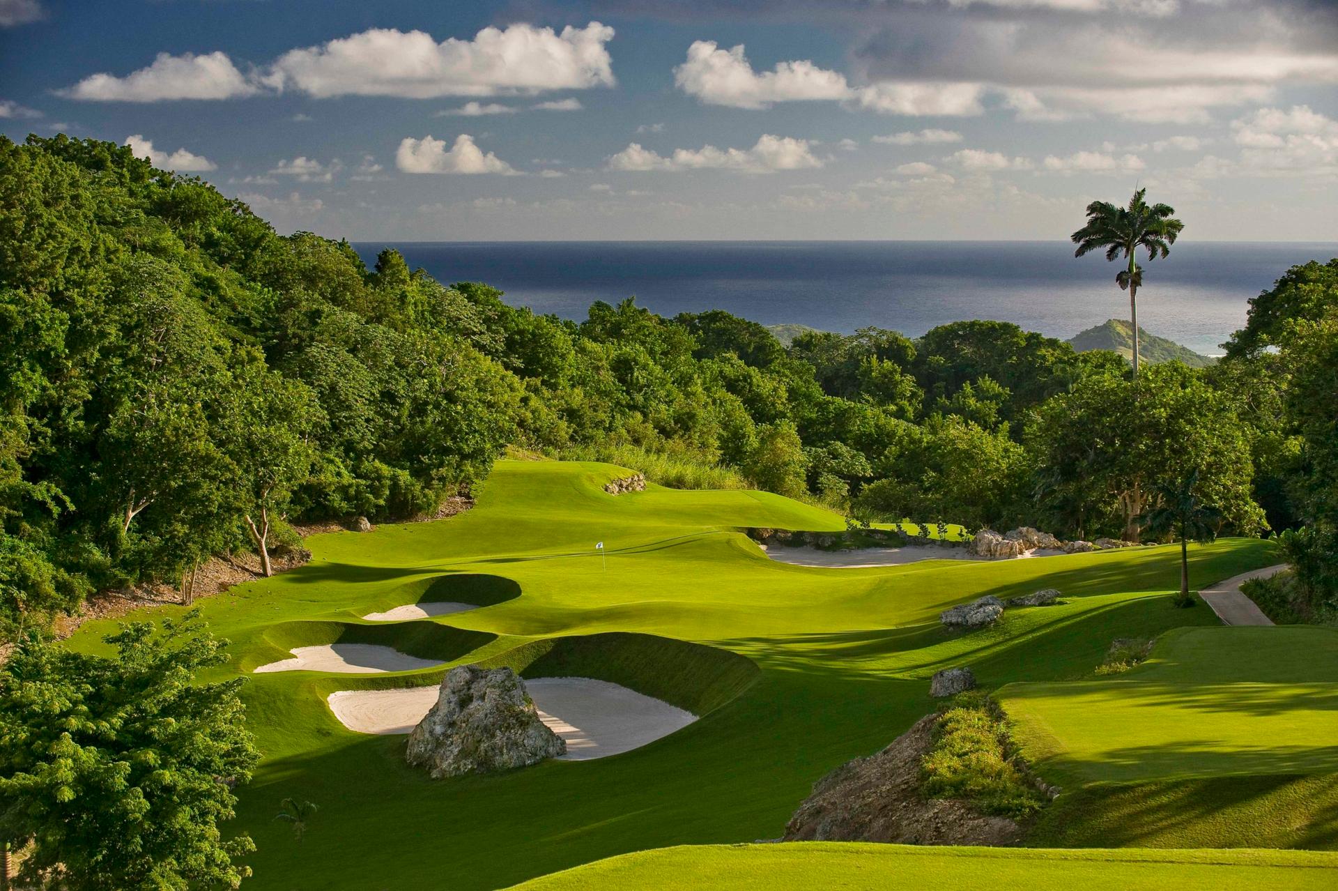 Overhead view of a well maintained fairway nestled with sand bunkers