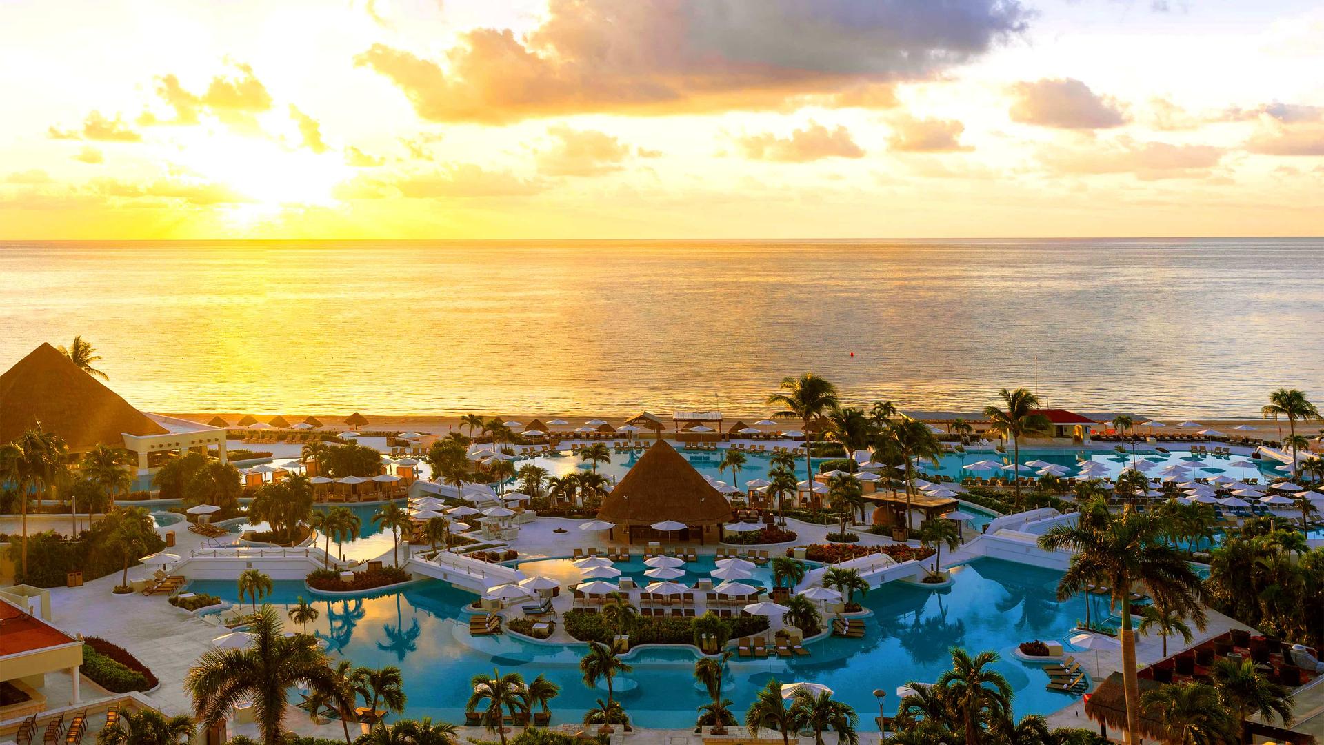 Panoramic view of an outdoor swimming pool at Moon Palace Resort