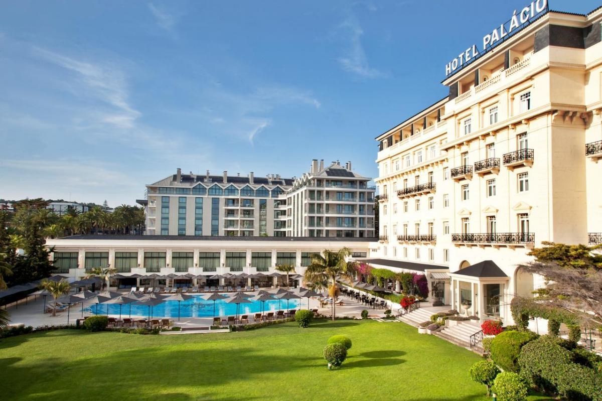 Panoramic view of the Palacio Estoril Golf & Spa Hotel building overlooking the outdoor pool