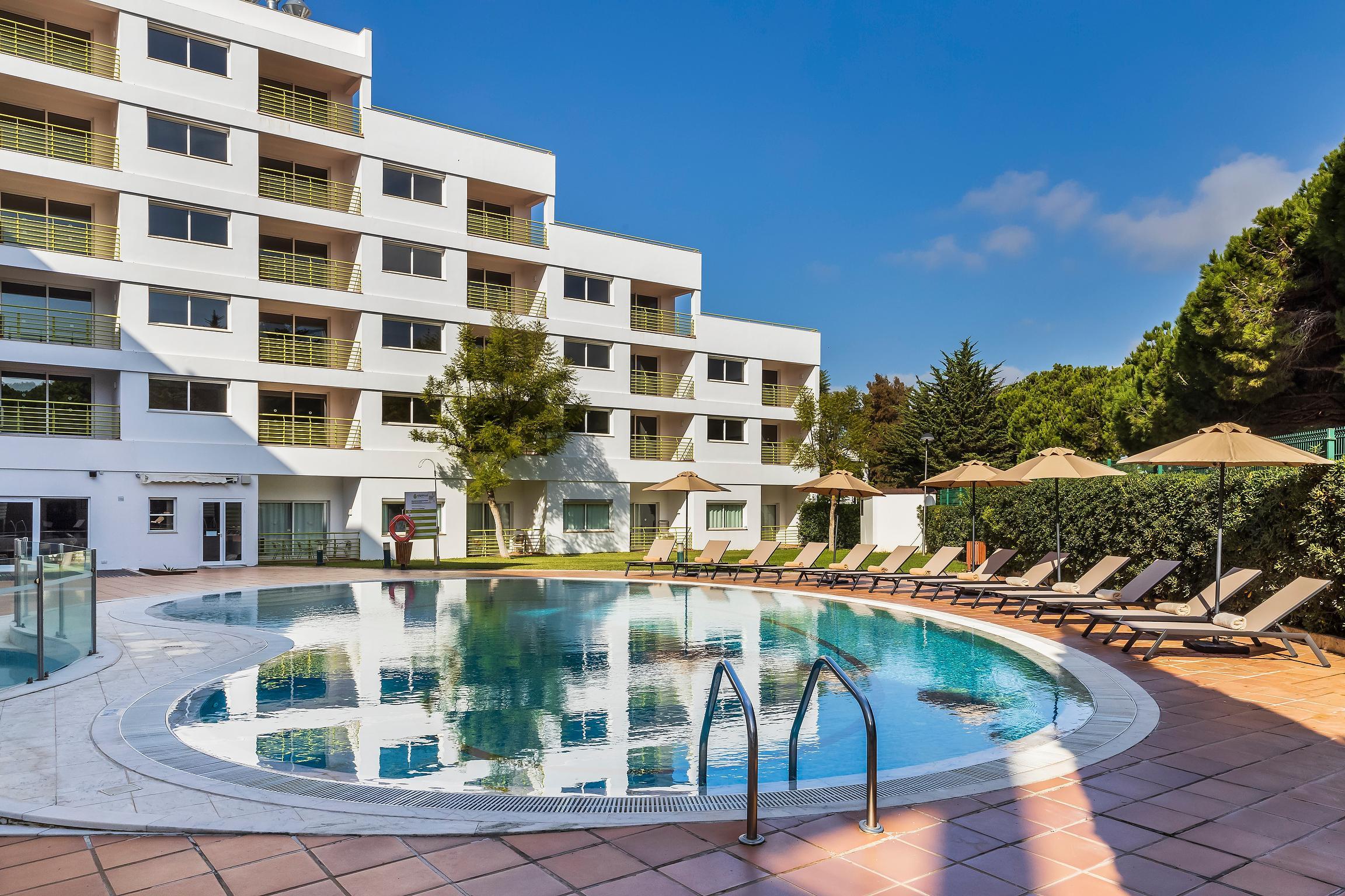 Outdoor swimming pool at The Patio Suite Hotel