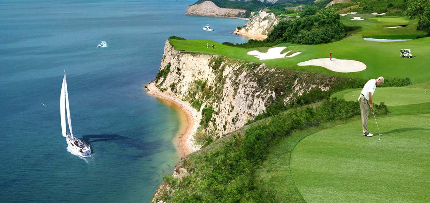 A coastal green with sand bunkers at the Lighthouse Golf & Spa Resort