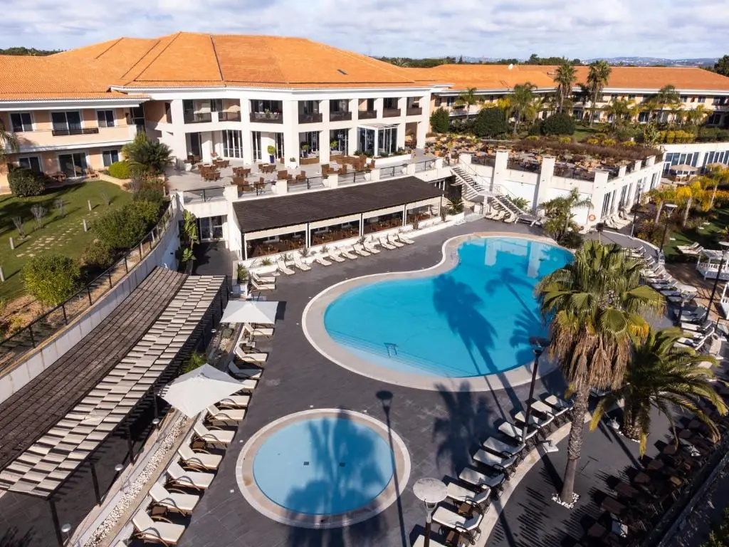 Overhead view of the Wyndham Grand Algarve building and outdoor swimming pool
