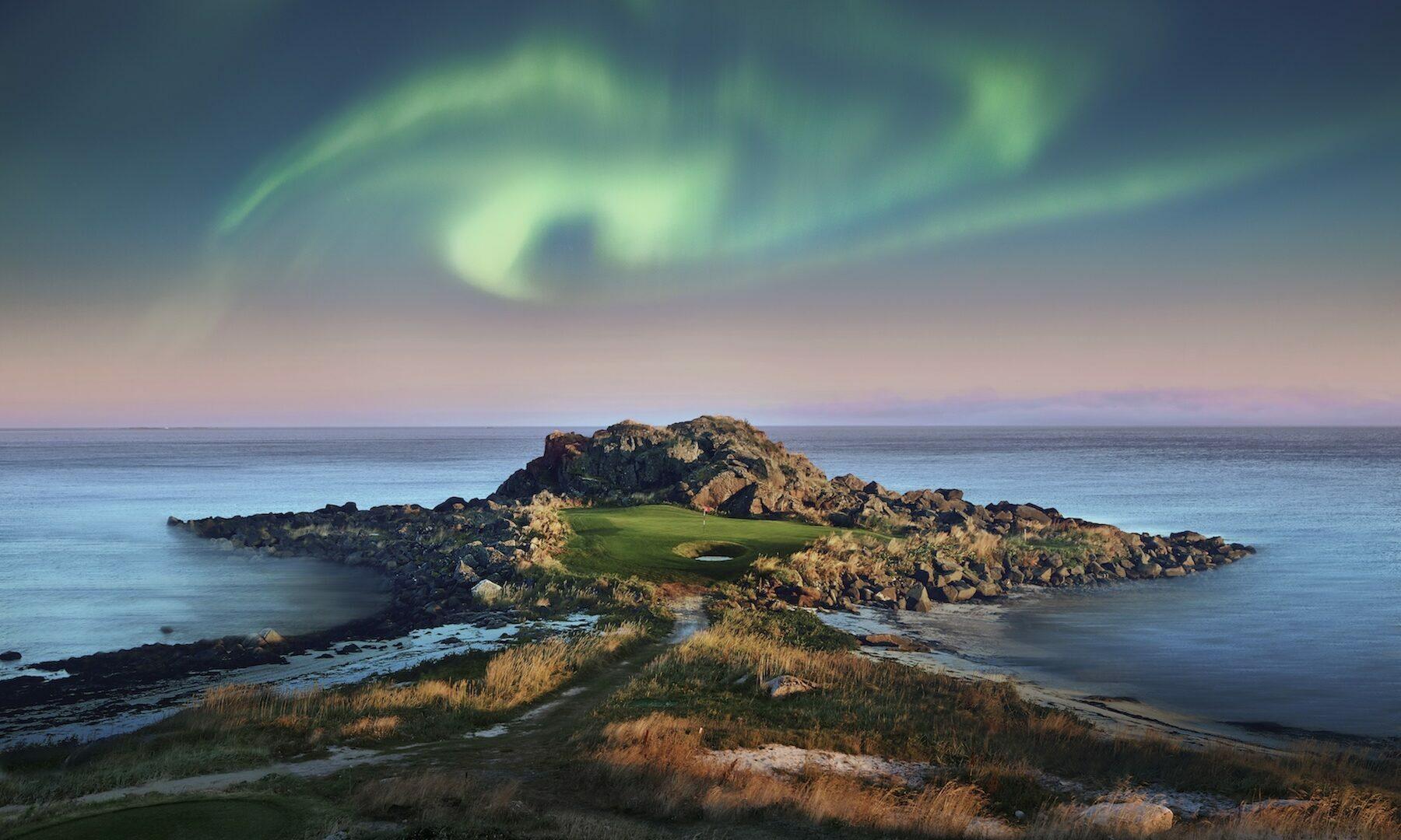 An island green under the northern lights at Lofoten Links