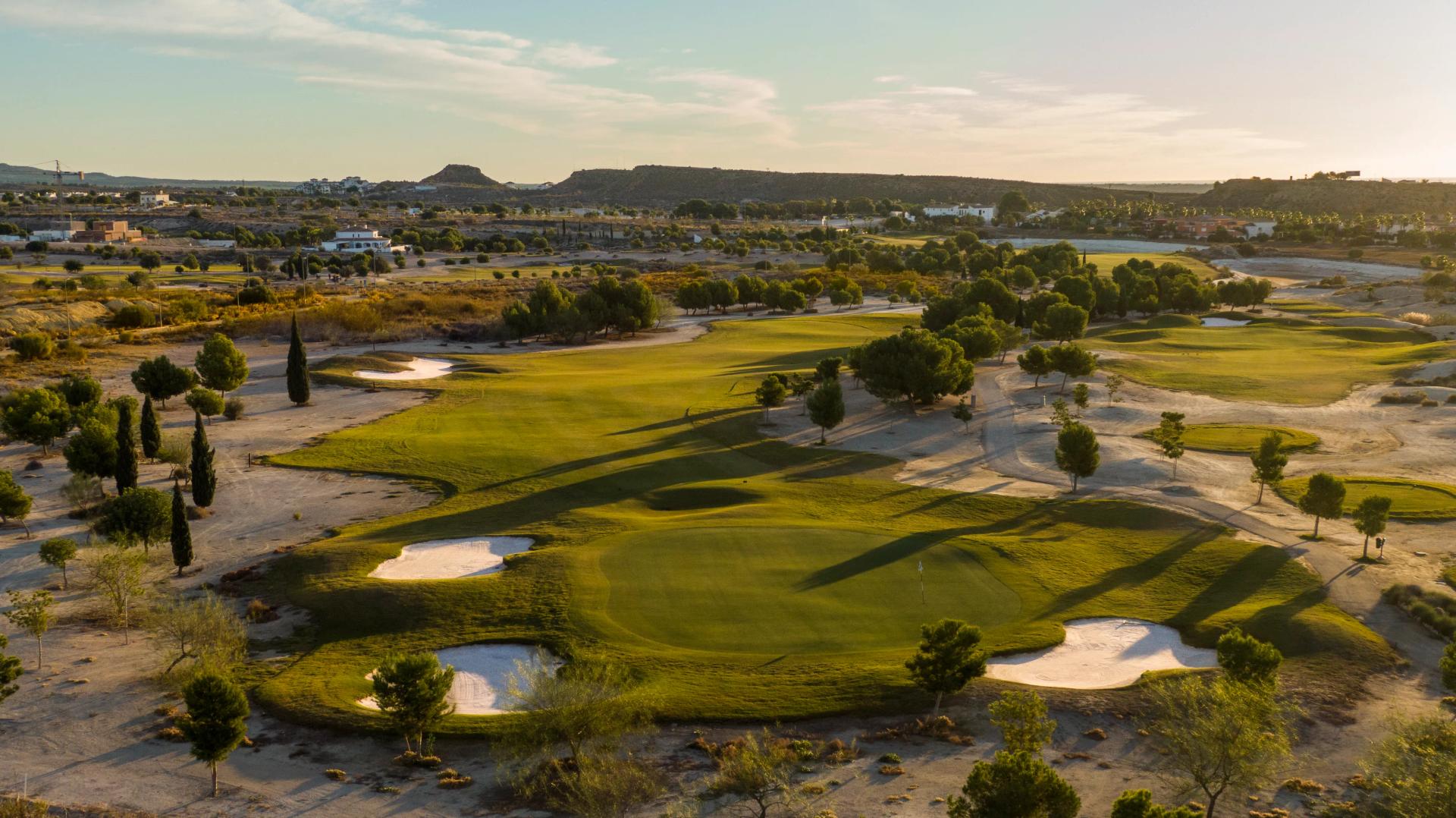 A smooth green surrounded by sand bunkers