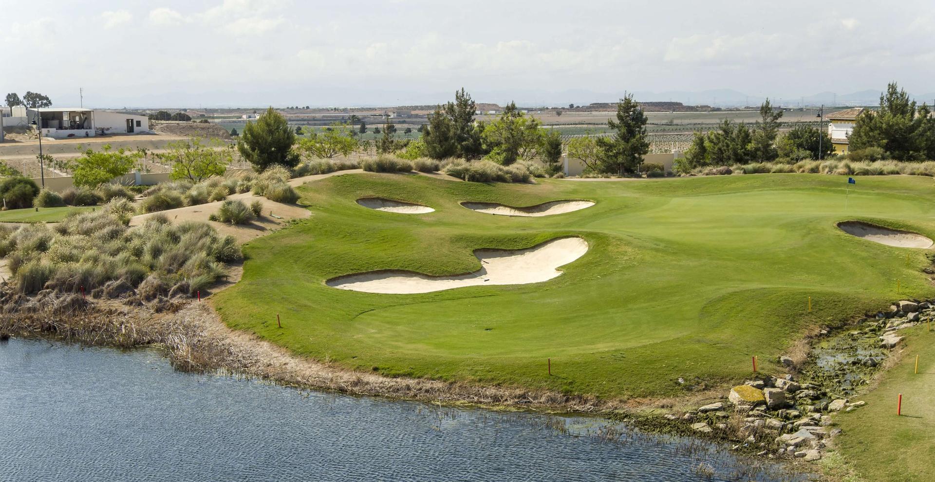 A well maintained fairway nestled with sand bunkers at Altaona Village