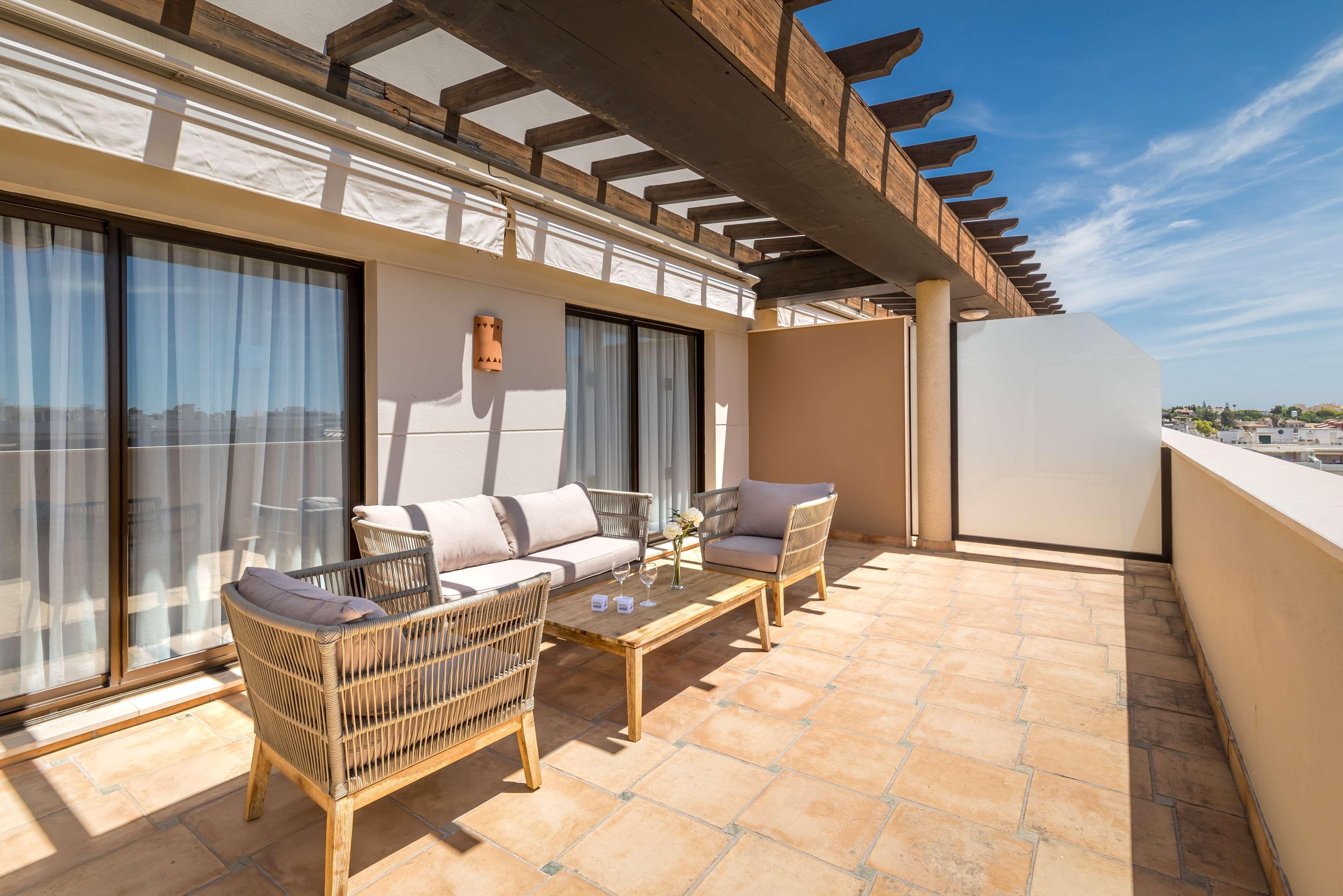 Balcony lounging area at Barcelo Marbella Hotel