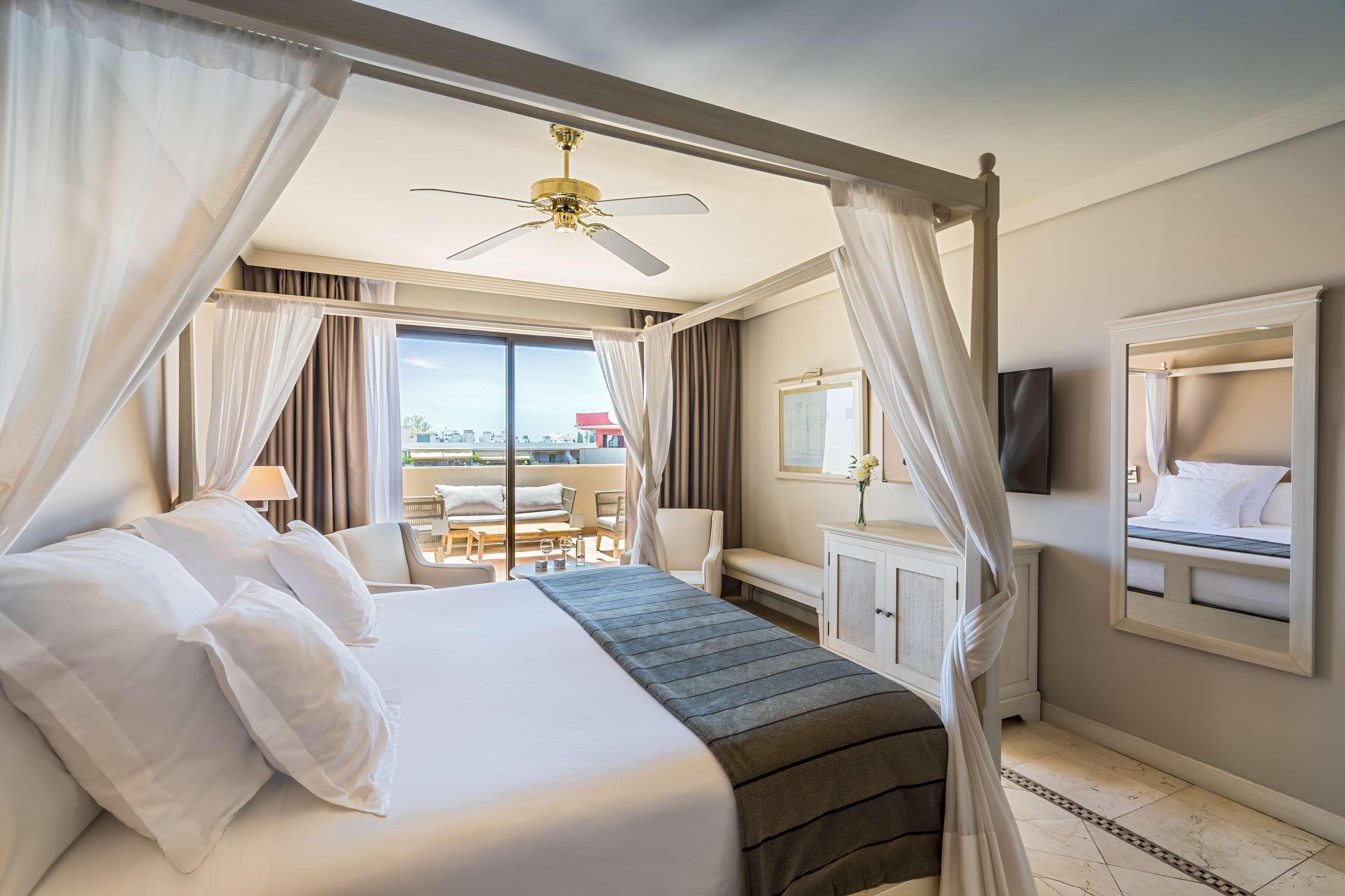 A grand double bed suite with balcony views