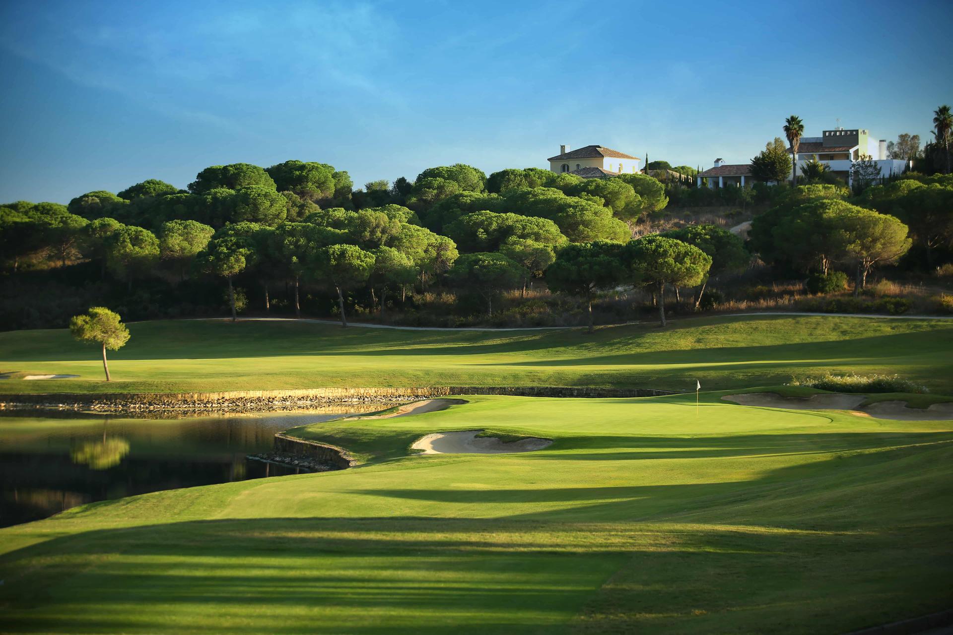 Green on Montecastillo golf course with a water hazard behind