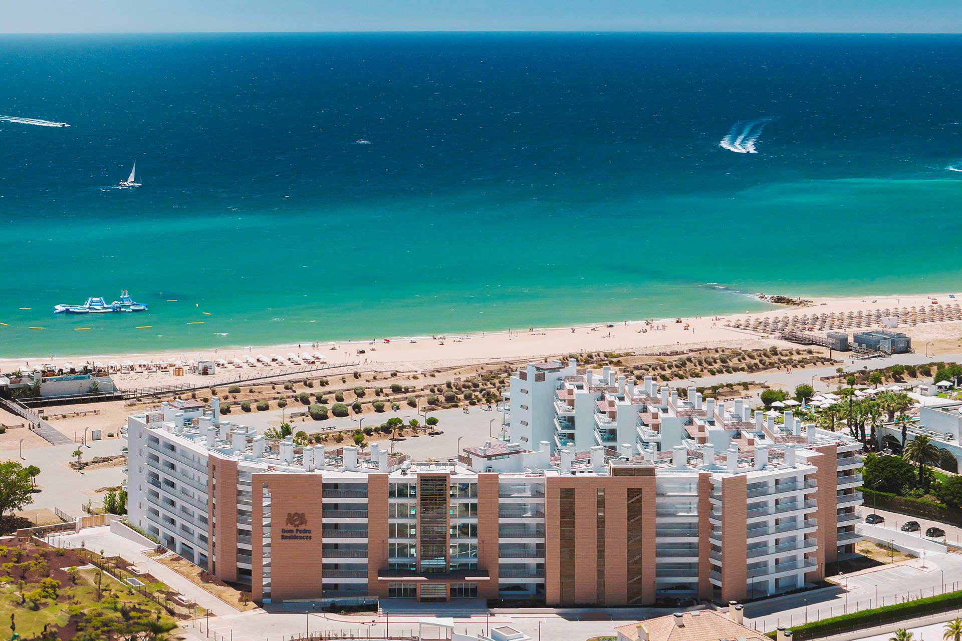 Overhead view of the Dom Pedro Residences right next to the beach