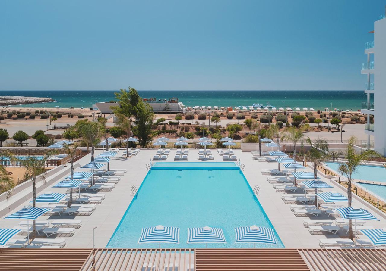 Overhead view of the outdoor swimming pool with coastal views
