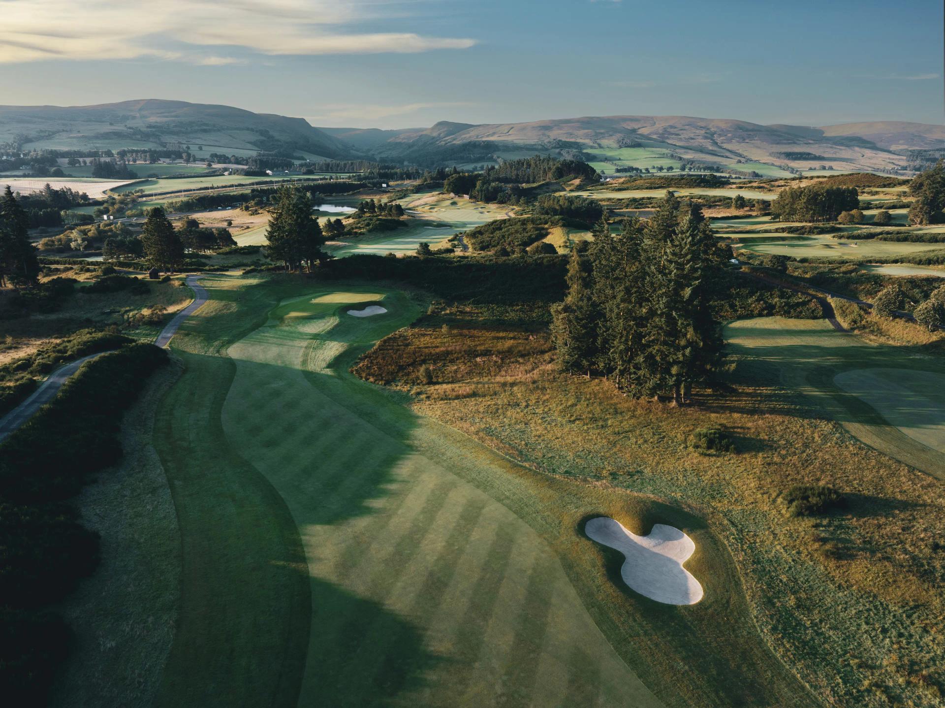 A well maintained fairway with a sand bunker
