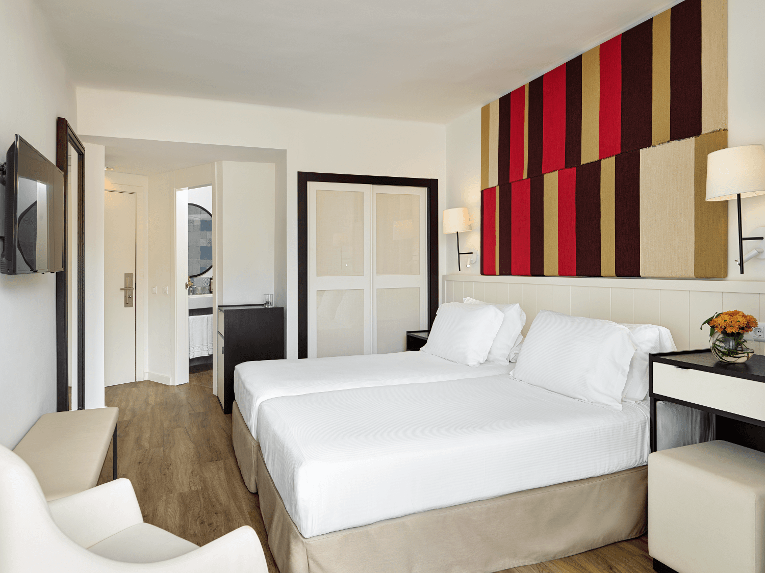 Modern double bed room at H10 Casa Del Mar with a smart TV on the wall