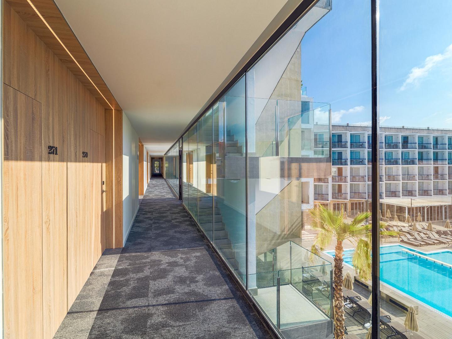 Glass corridor at the H10 Casa Del Mar with view of the outdoor swimming pool