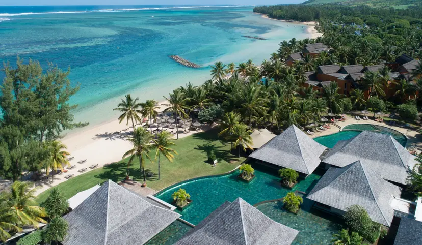 Overhead view of an outdoor swimming pool with cabanas