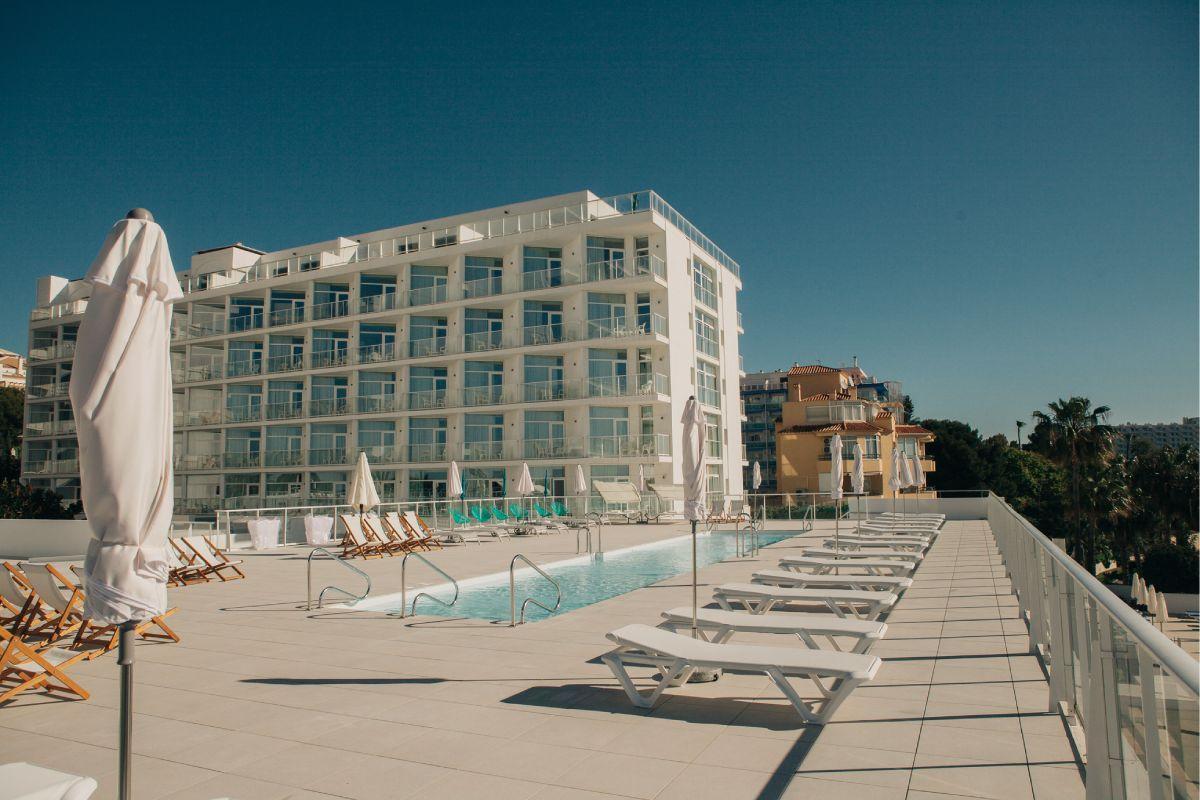 Outdoor pool area with the hotel in the background