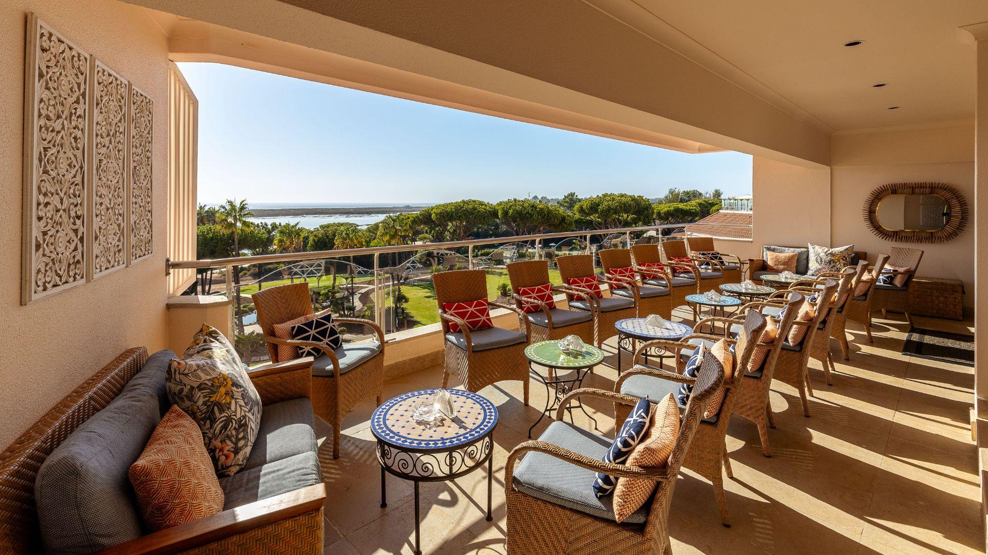 Outdoor lounging area at Hotel Quinta do Lago with balcony views