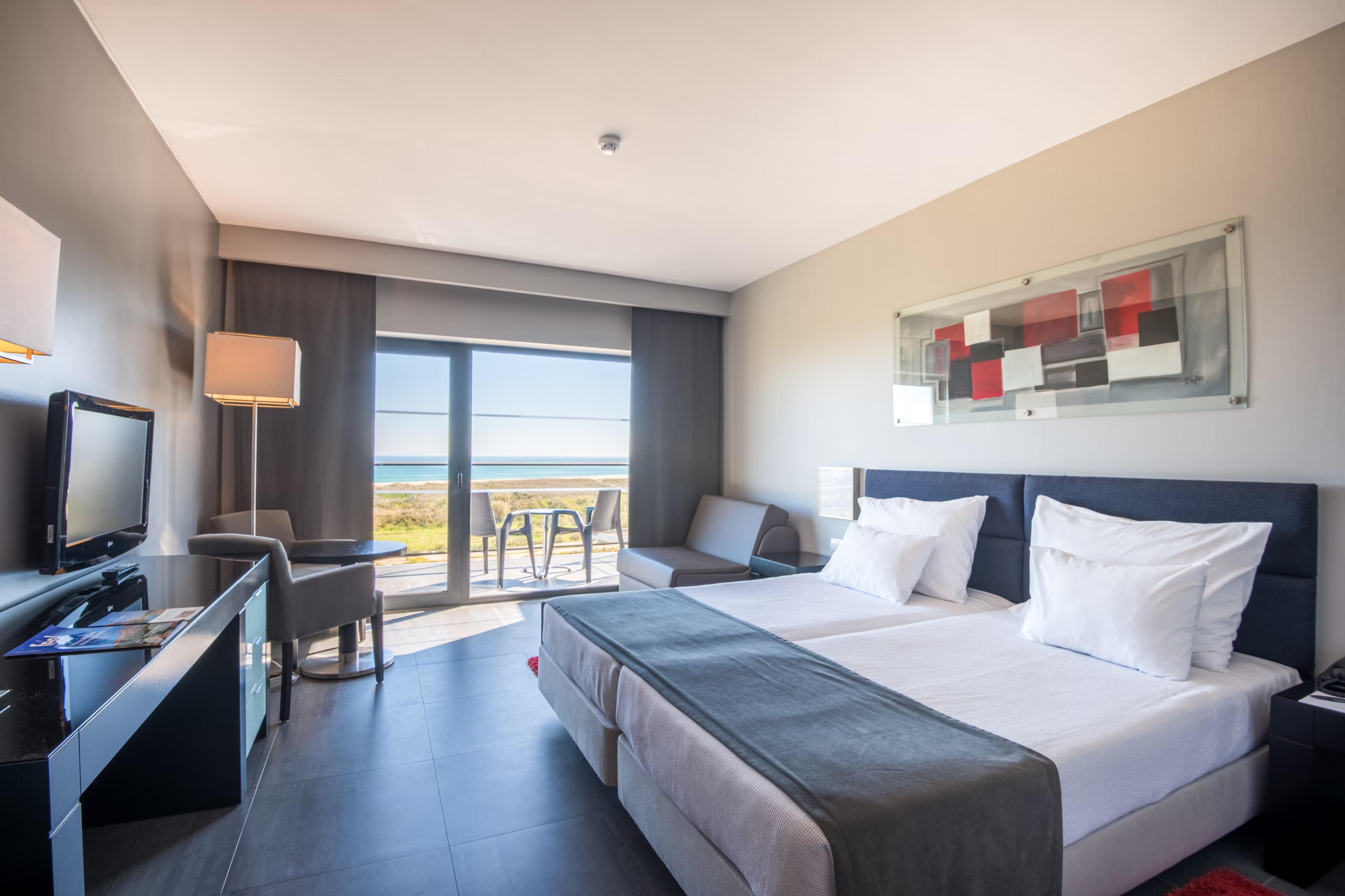 Double bed room at the hotel with balcony views