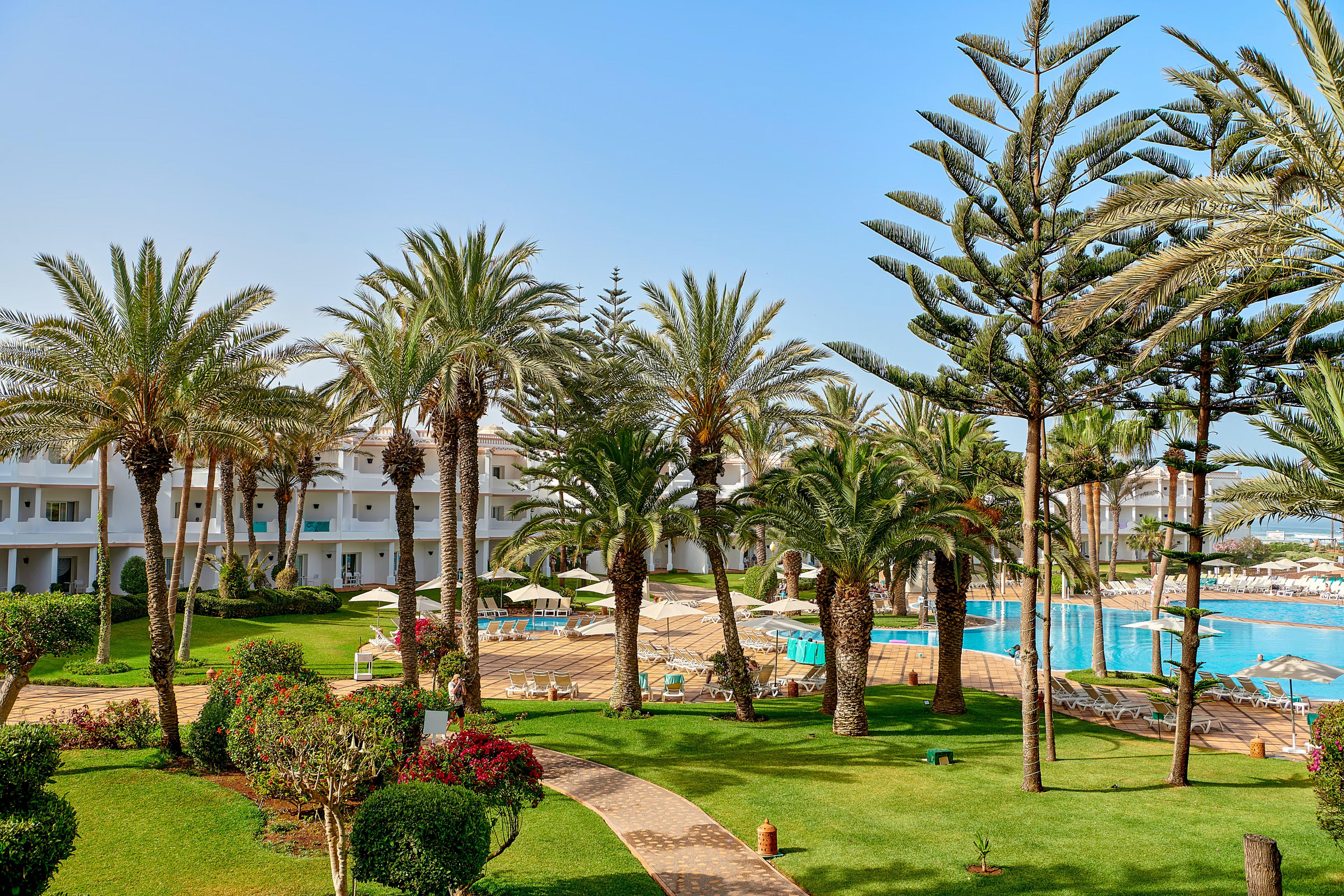 A walkway next to the outdoor swimming pool at Iberostar Founty