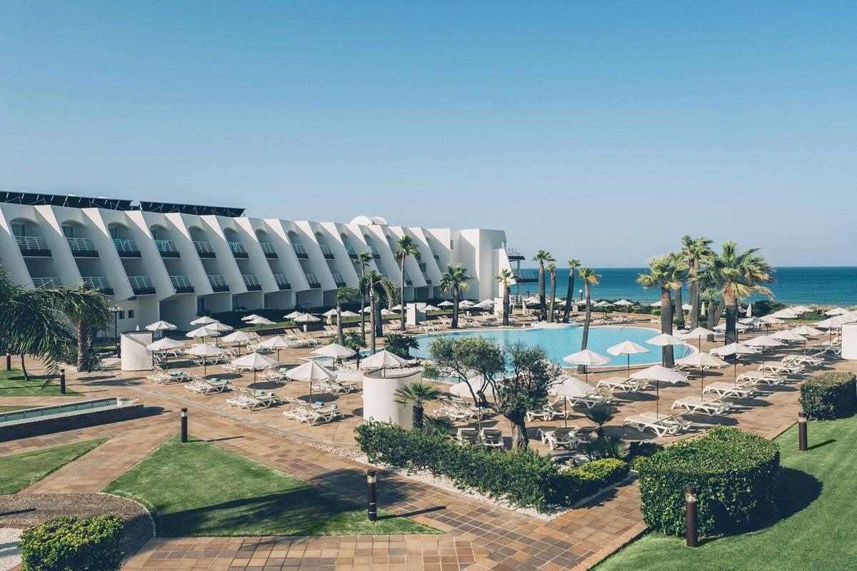 View of the back of the Iberostar Waves Royal Andalus with blue sky visible
