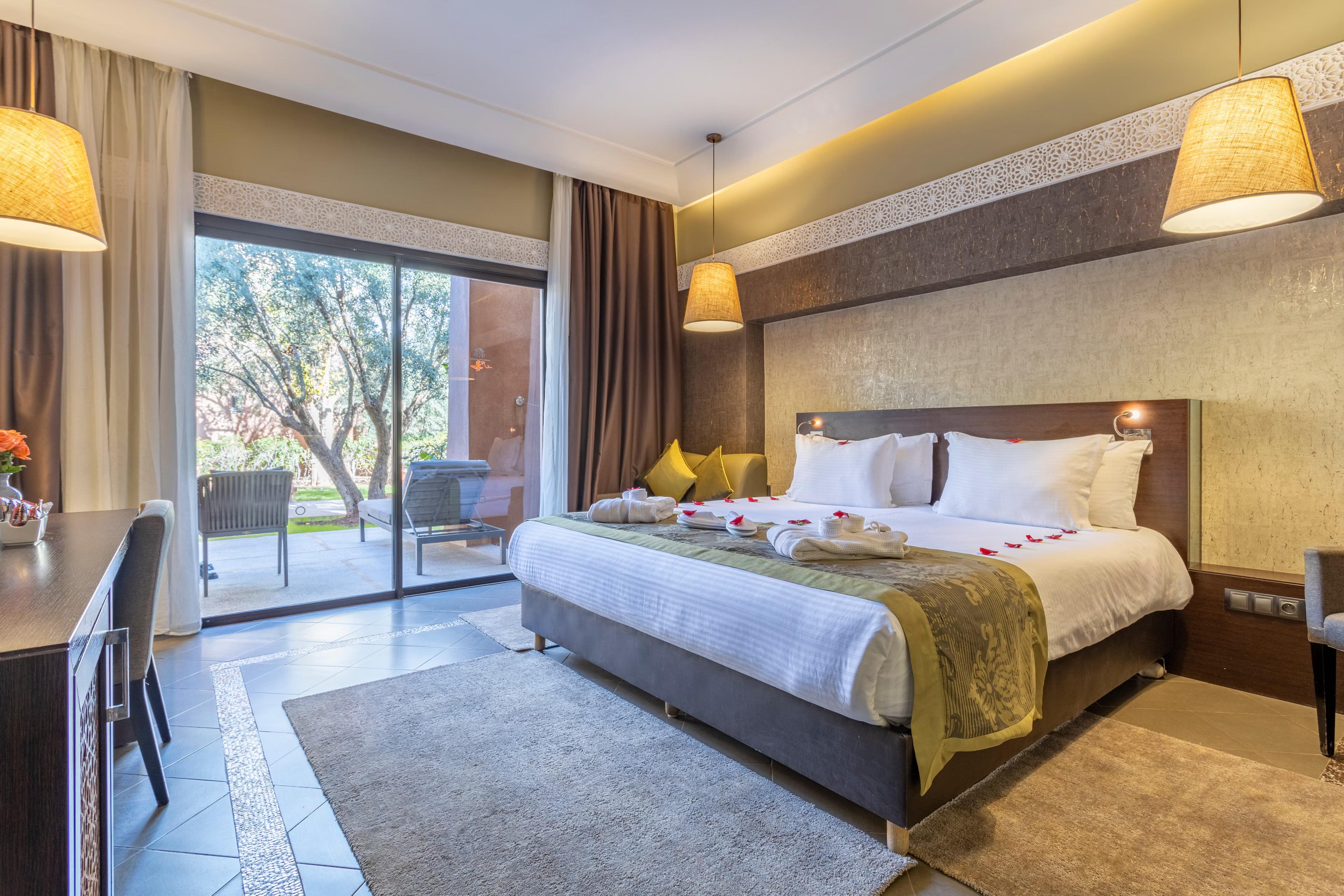 Spacious modern double bed room at Kenzi Club Agdal Medina with balcony views